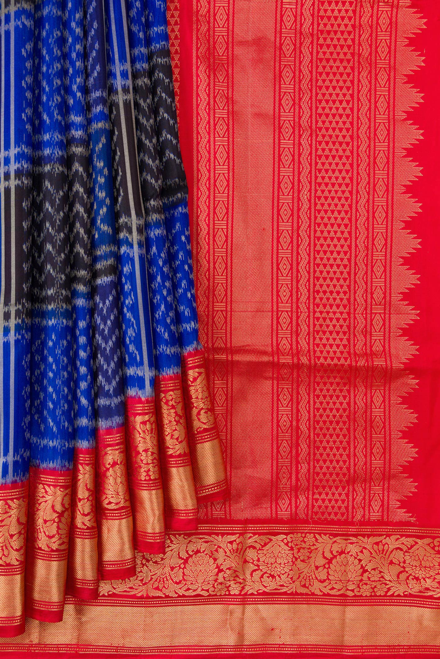 Pleats and pallu of Royal Blue Dual Tone Soft Silk Saree with Ikat Print on the body and Zari Border. 