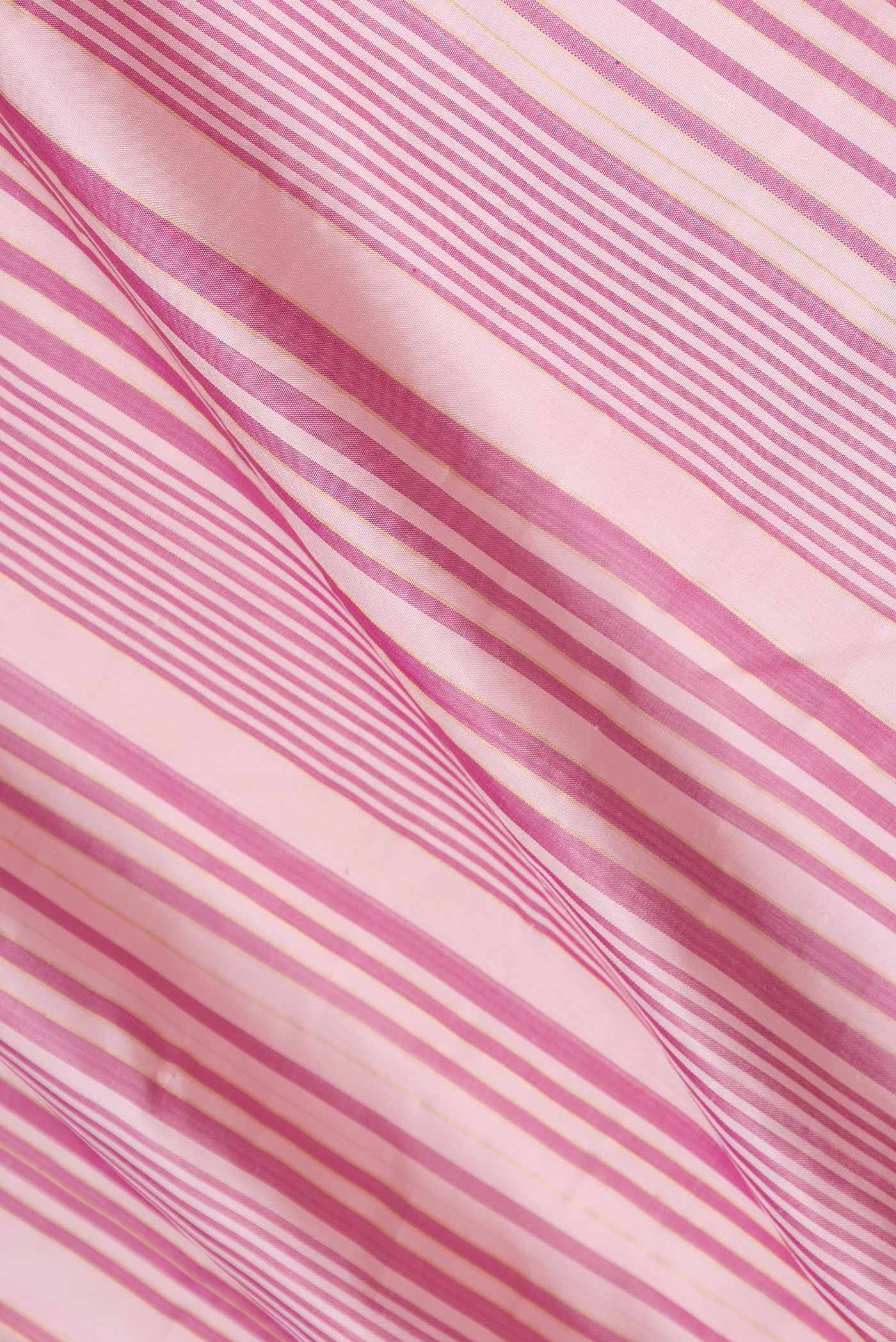 Close up of Pink Dual Tone Kanchipuram Silk Saree with Stripes on the body and Zari Border displaying folds