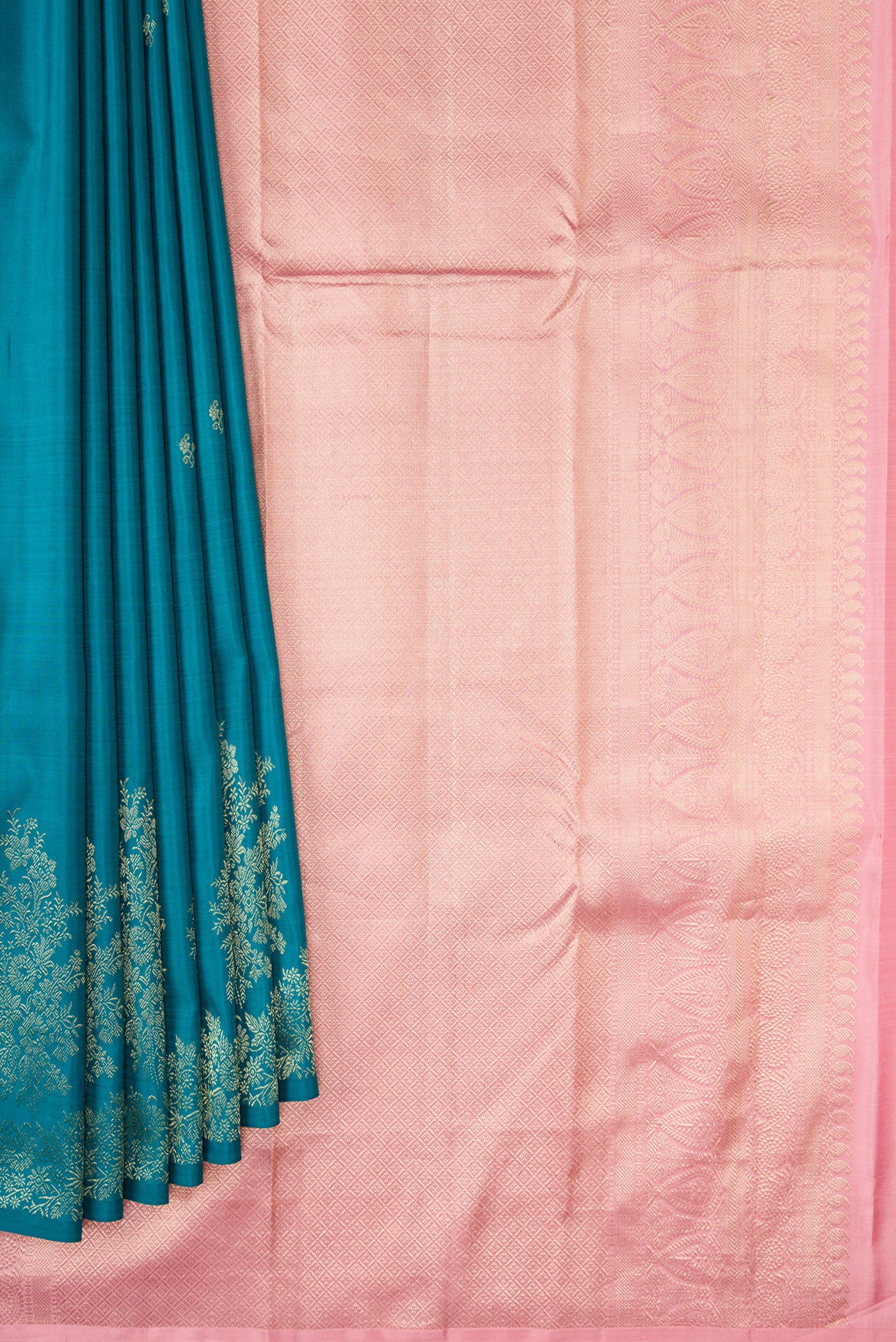 Pleats and pallu of Peacock Blue Dual Tone Kanjivaram Silk Saree with Zari Butta on the body and Fancy Border. 