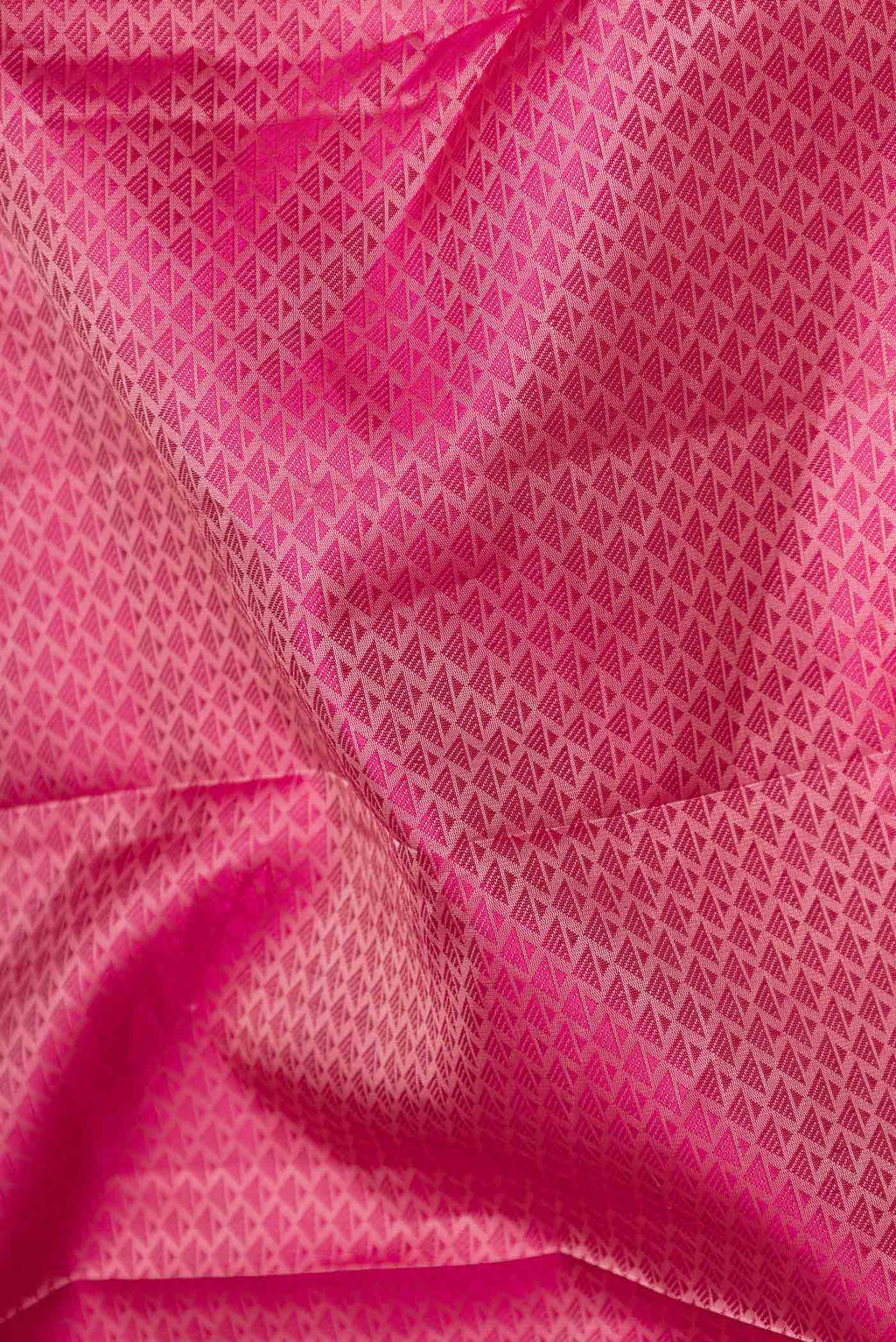 Close up of Pink Dual Tone Kanchipuram Saree with Jacquard design on the body and Zari Border displaying folds