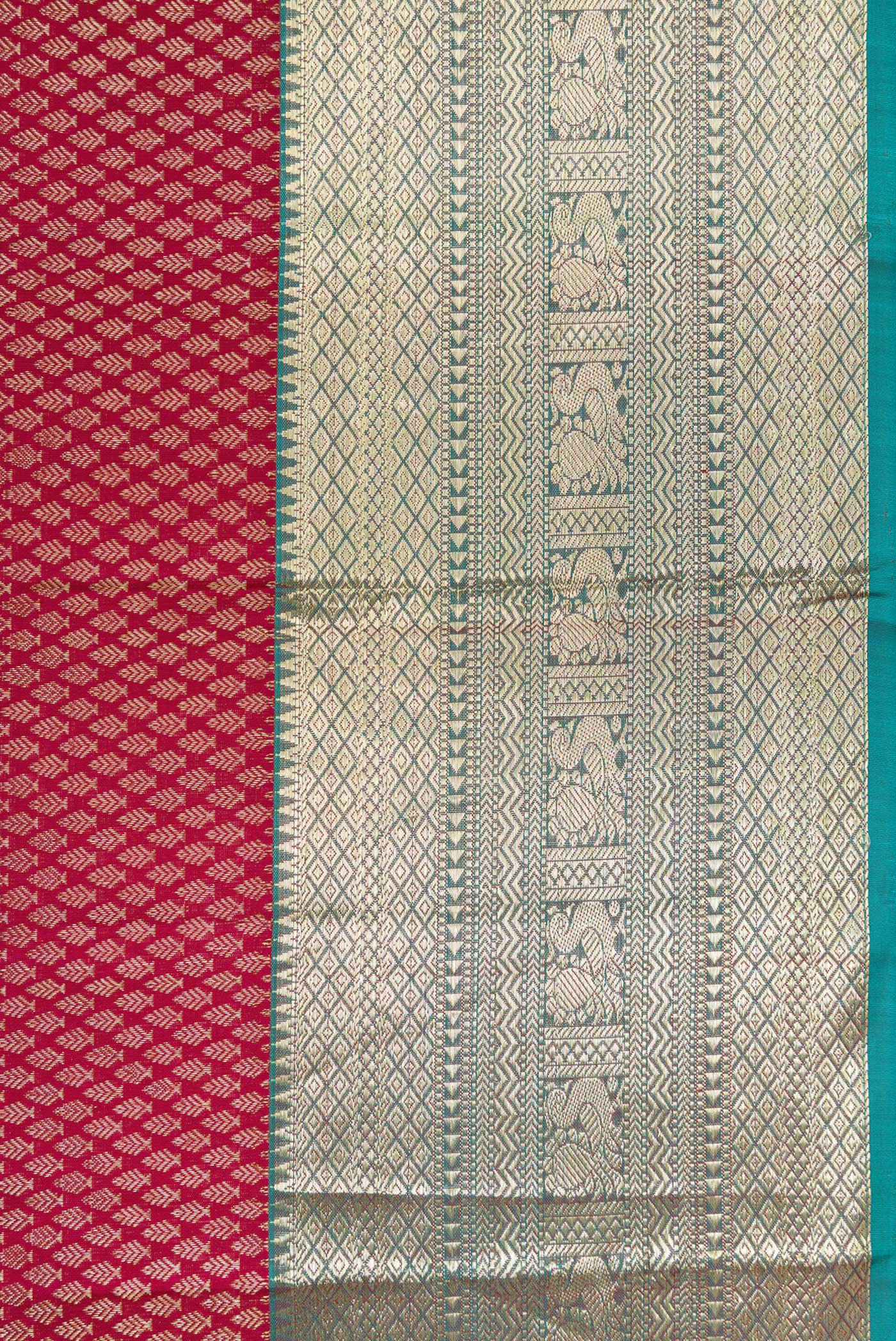 Border image of Maroon Dual Tone Kanjivaram Silk Saree with Zari Brocade on the body and Zari Border. 