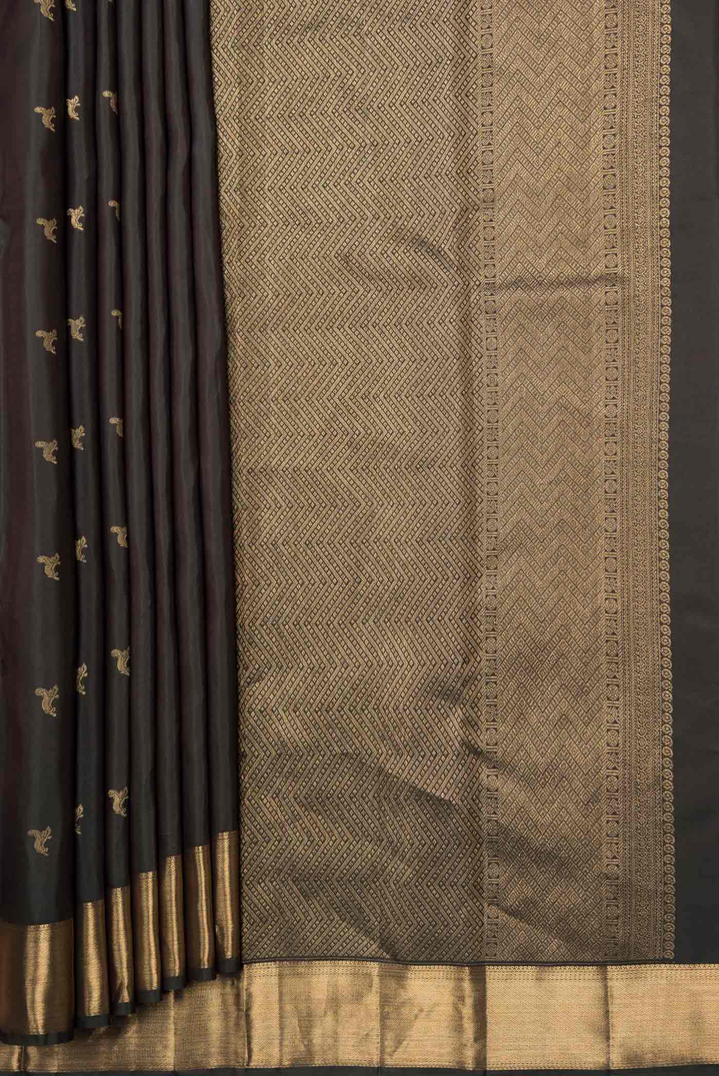 Pleats and pallu of Bottle Green Dual Tone Kanchipuram Silk Saree with Zari Butta on the body and Zari Border
