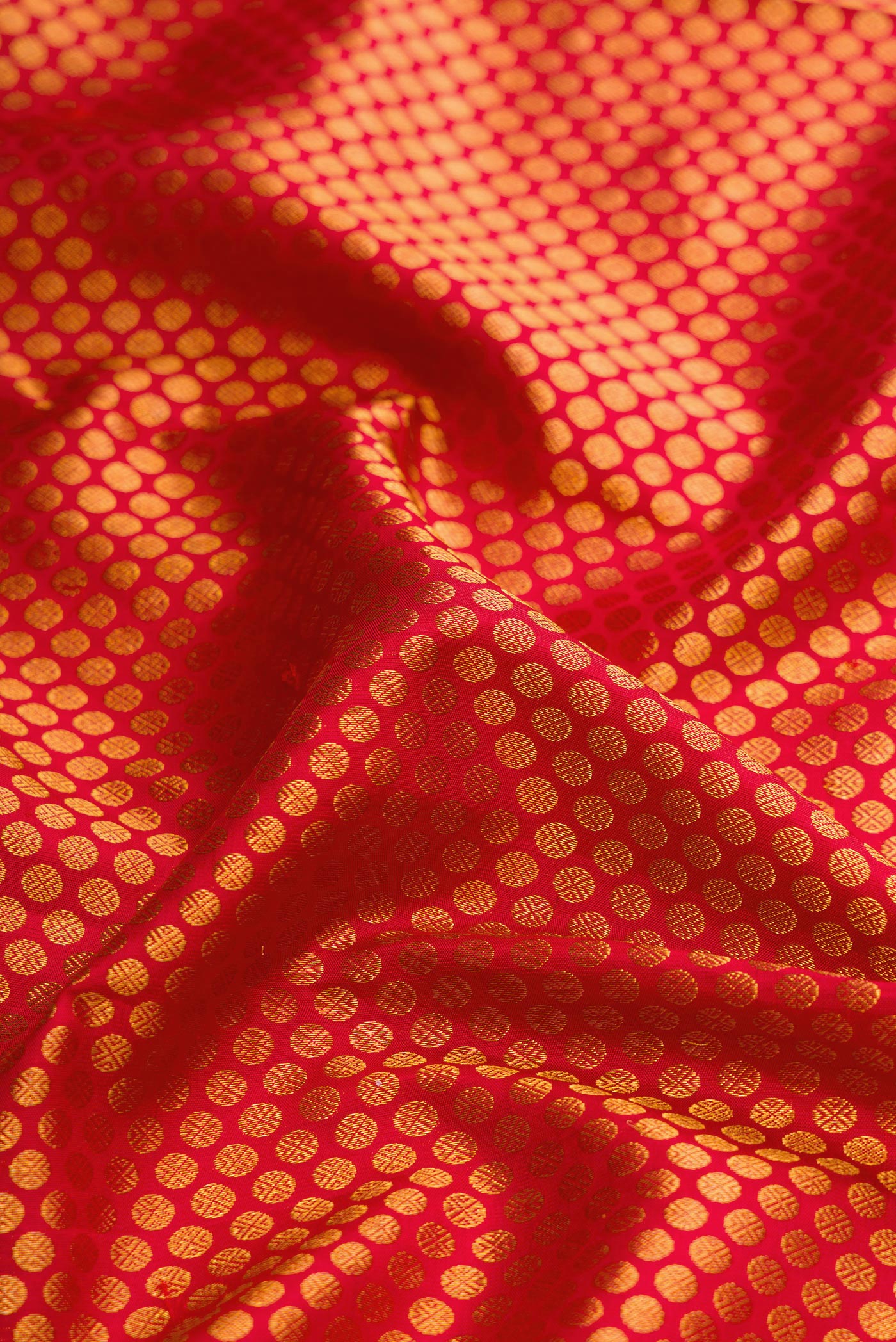 Close up of Maroon Dual Tone Kanchipuram Silk Saree with Zari Brocade on the body and Zari Border.  displaying folds