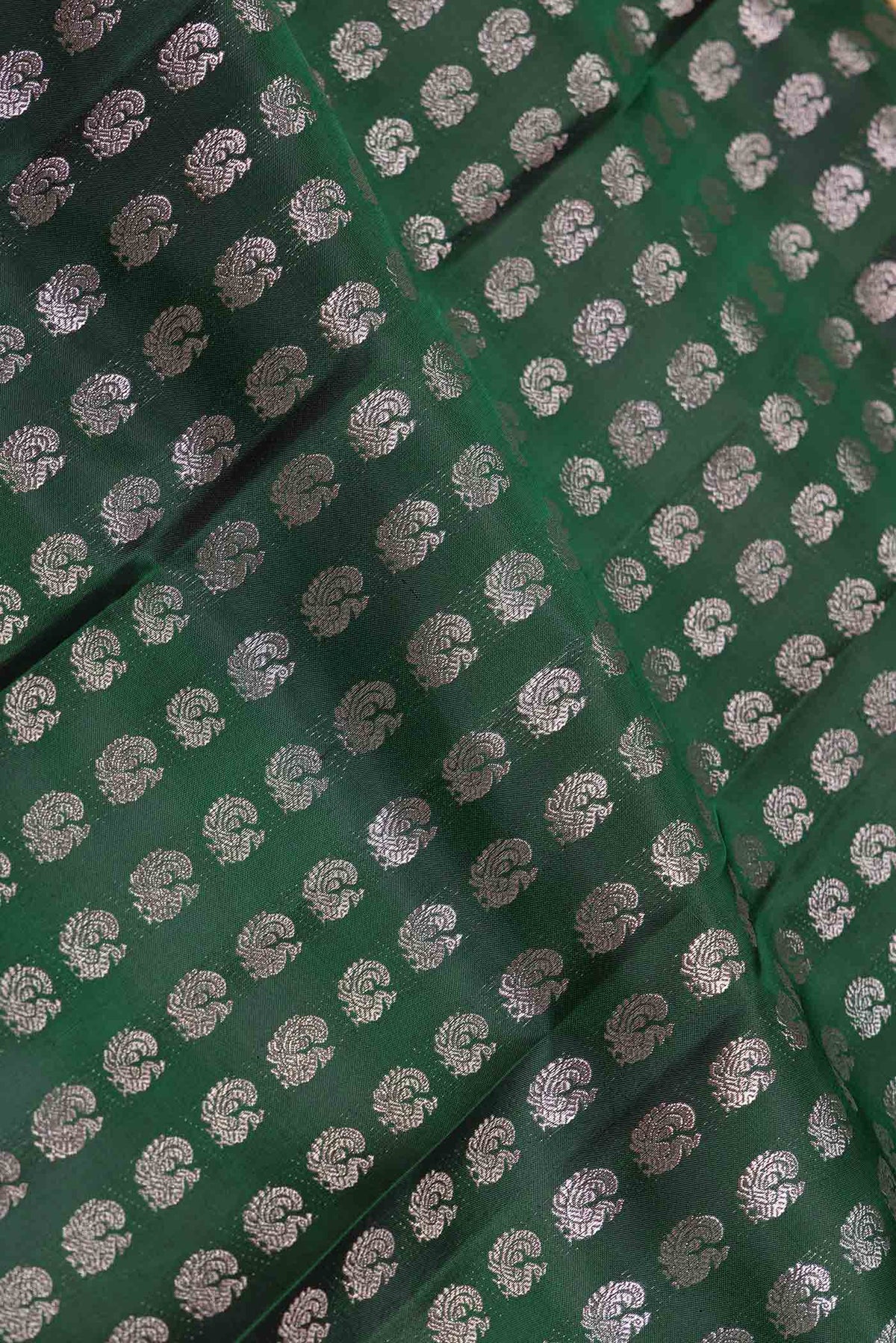 Close up of Green Dual Tone Kanchipuram Saree with Zari Brocade on the body and Zari Border displaying folds