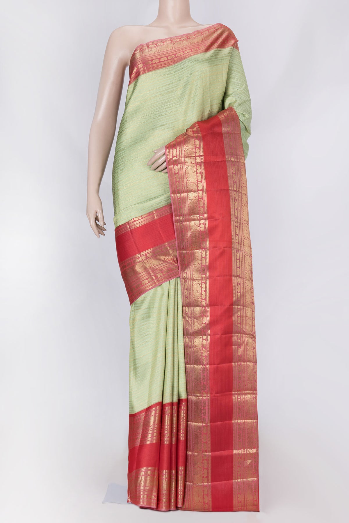 Pista Green Dual Tone Kanchipuram Saree with Zari Brocade on the body and Zari Border displayed on a mannequin
