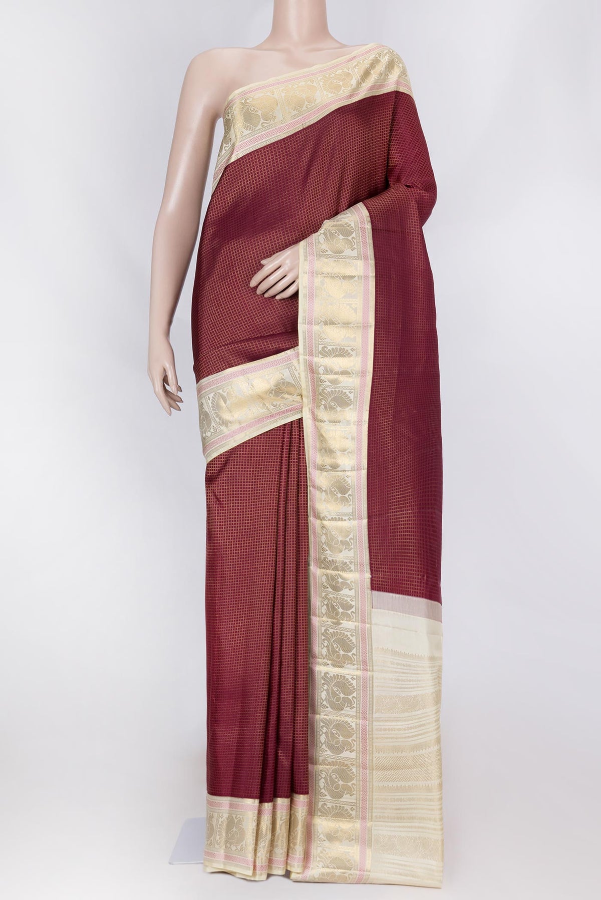 Maroon Dual Tone Kanchipuram Saree with Checked design on the body and Zari Border displayed on a mannequin