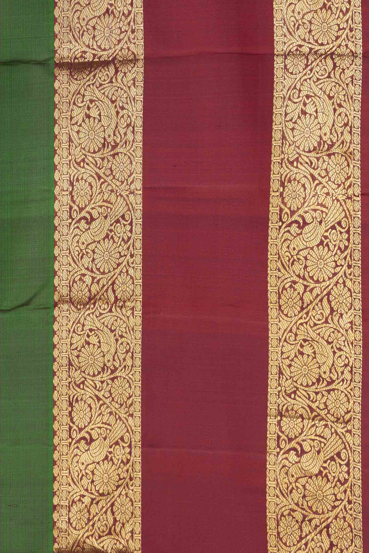 Border image of Green Dual Tone Kanchipuram Saree with Zari Butta on the body and Zari Border. 