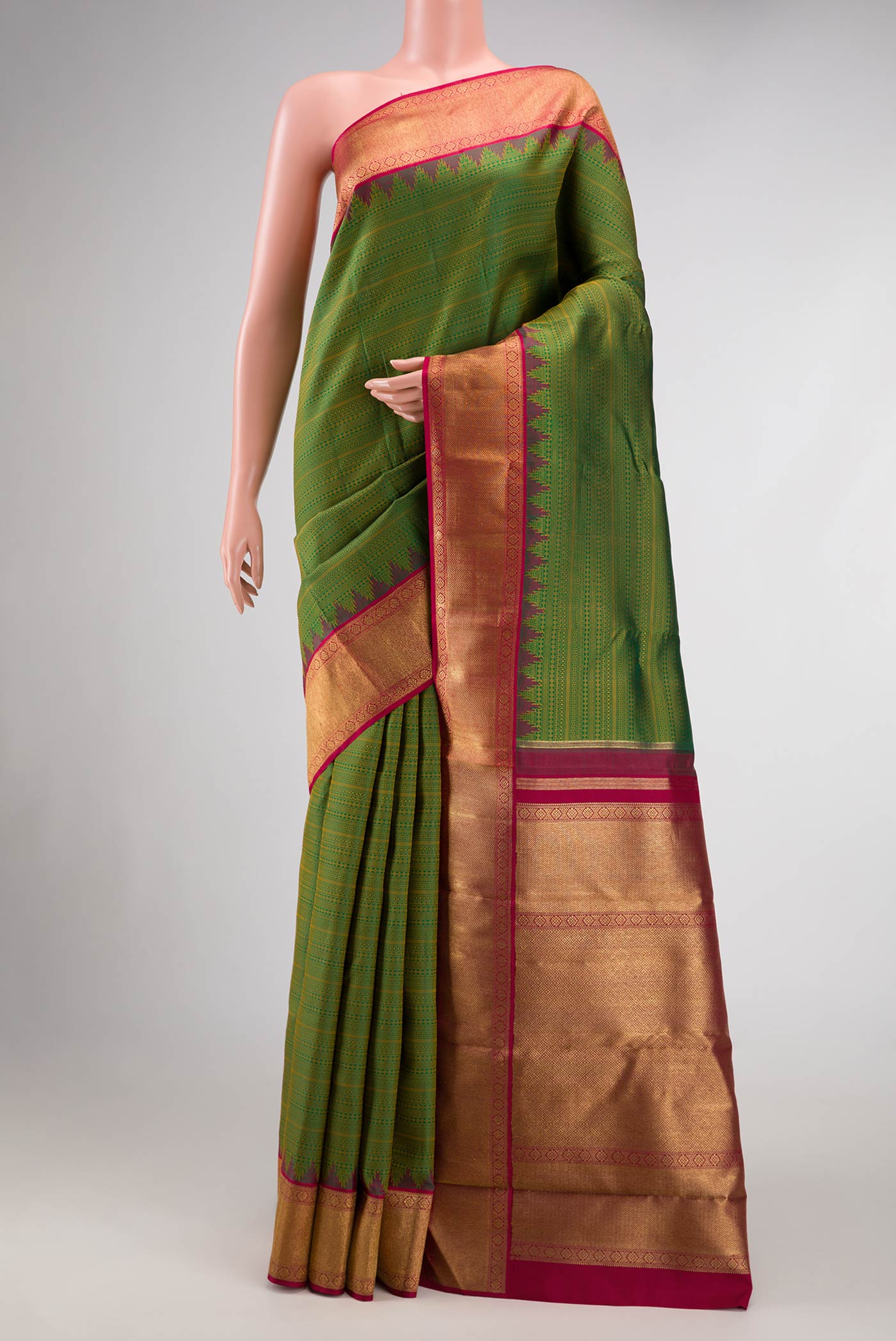 Pure Silk Pure Zari Green Dual Tone Kanjivaram Saree with Jacquard design on the body and Zari Border.  displayed on a mannequin