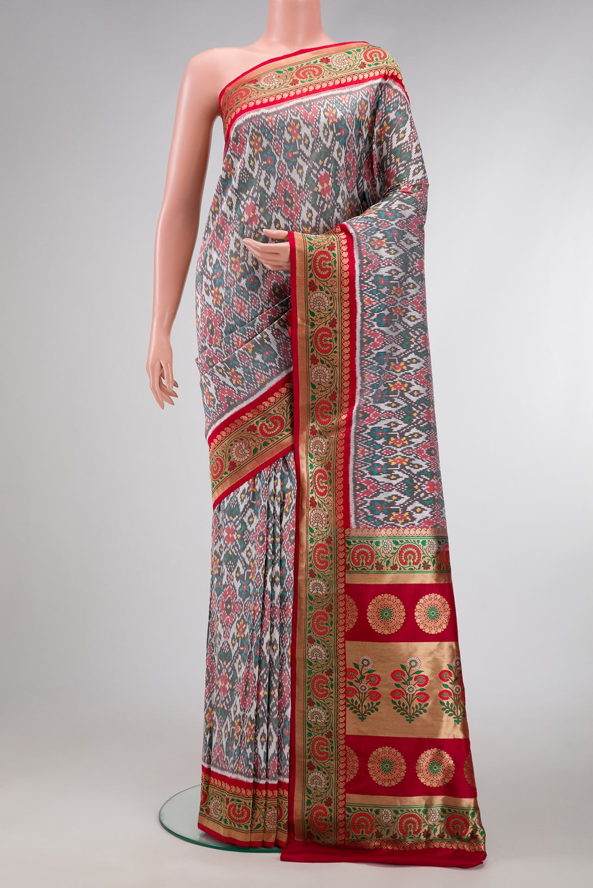 Grey Dual Tone Double Ikat Saree with Ikat Print on the body and Zari Border.  displayed on a mannequin