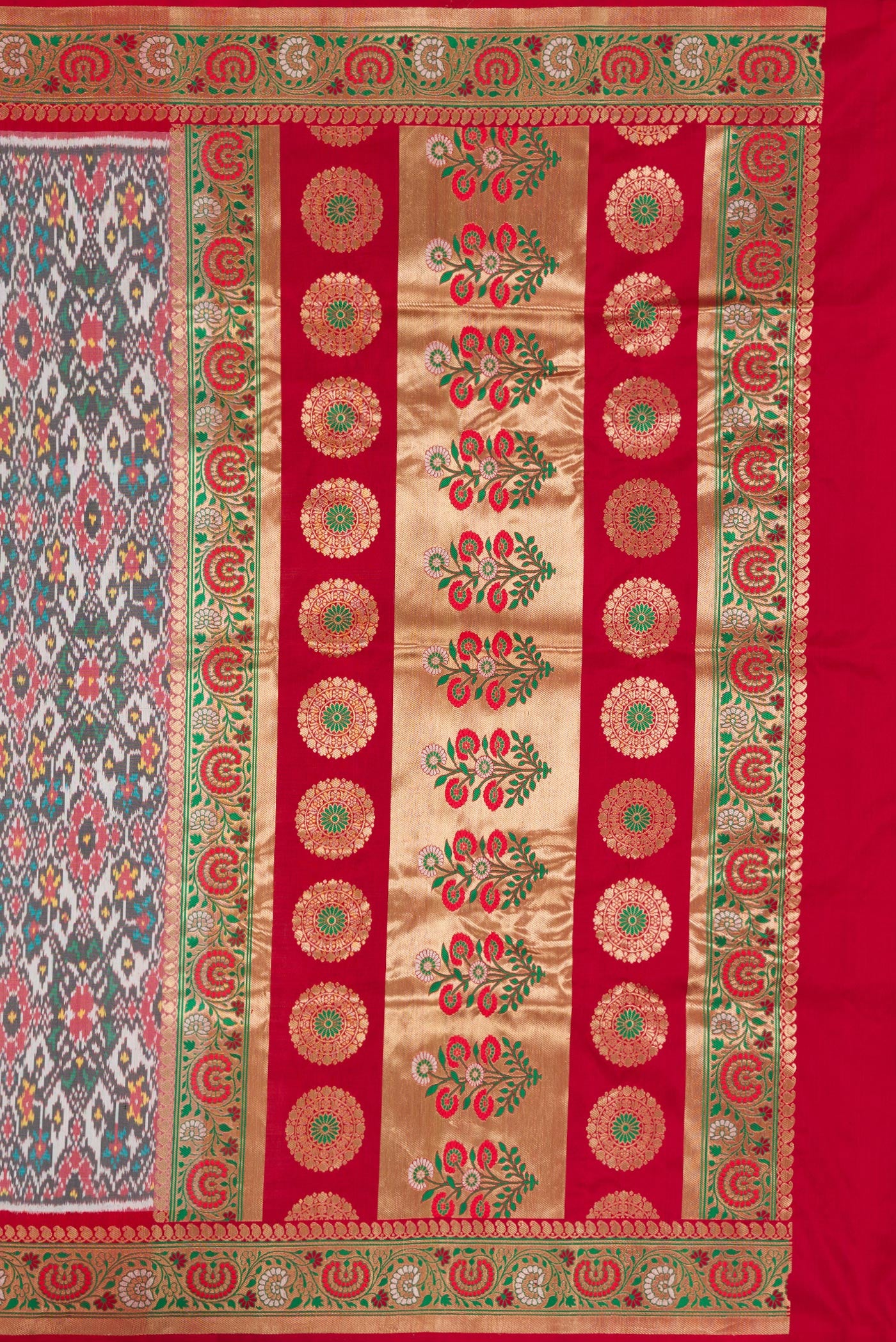 Close up image of the pallu of Grey Dual Tone Double Ikat Saree with Ikat Print on the body and Zari Border. 