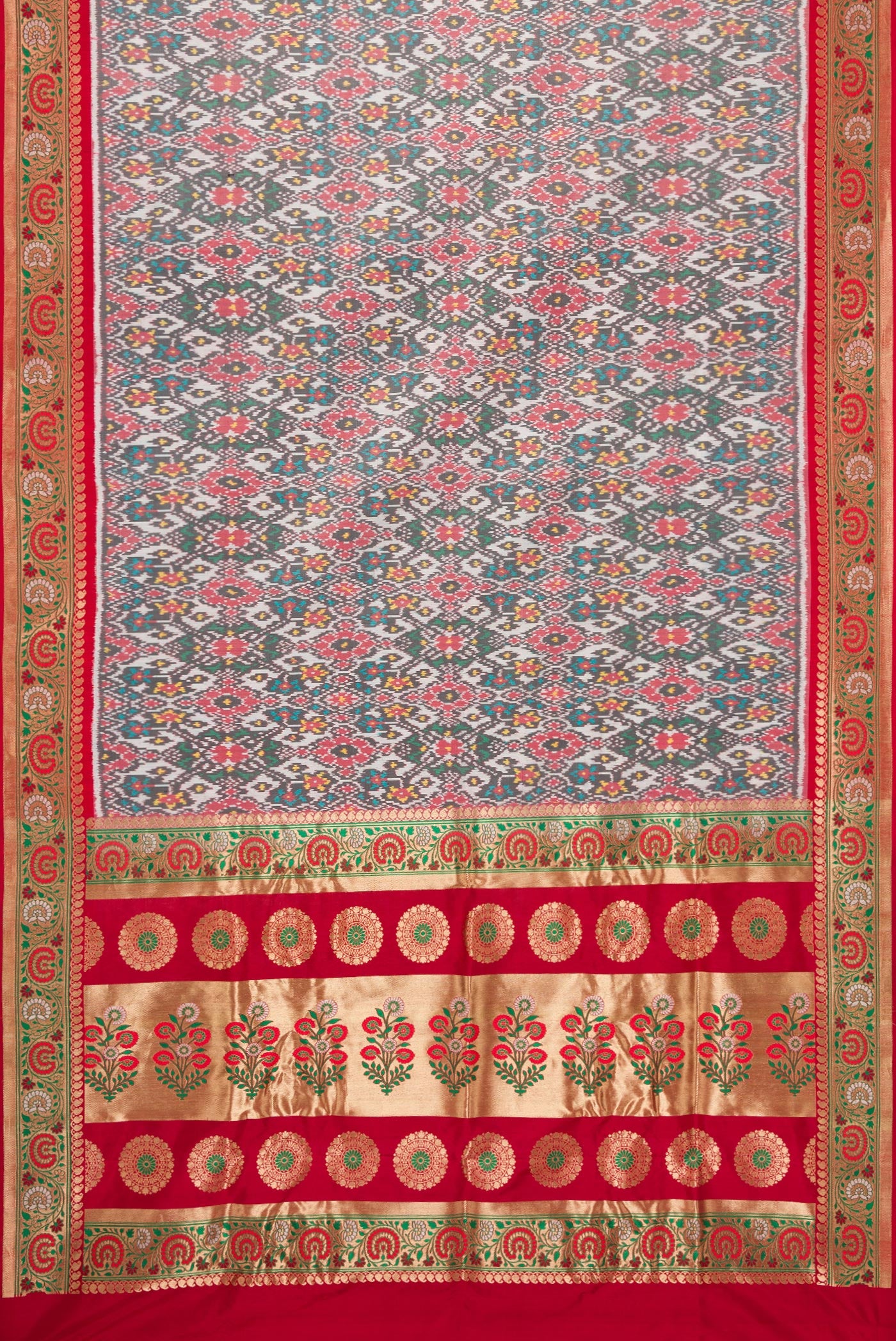 Flat view of Grey Dual Tone Double Ikat Saree with Ikat Print on the body and Zari Border. 
