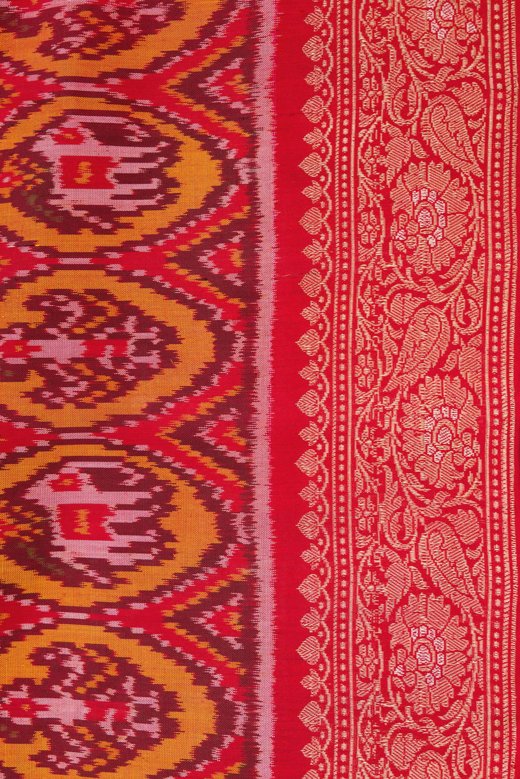 Border image of Red Dual Tone Double Ikat Saree with Ikat Print on the body and Zari Border. 
