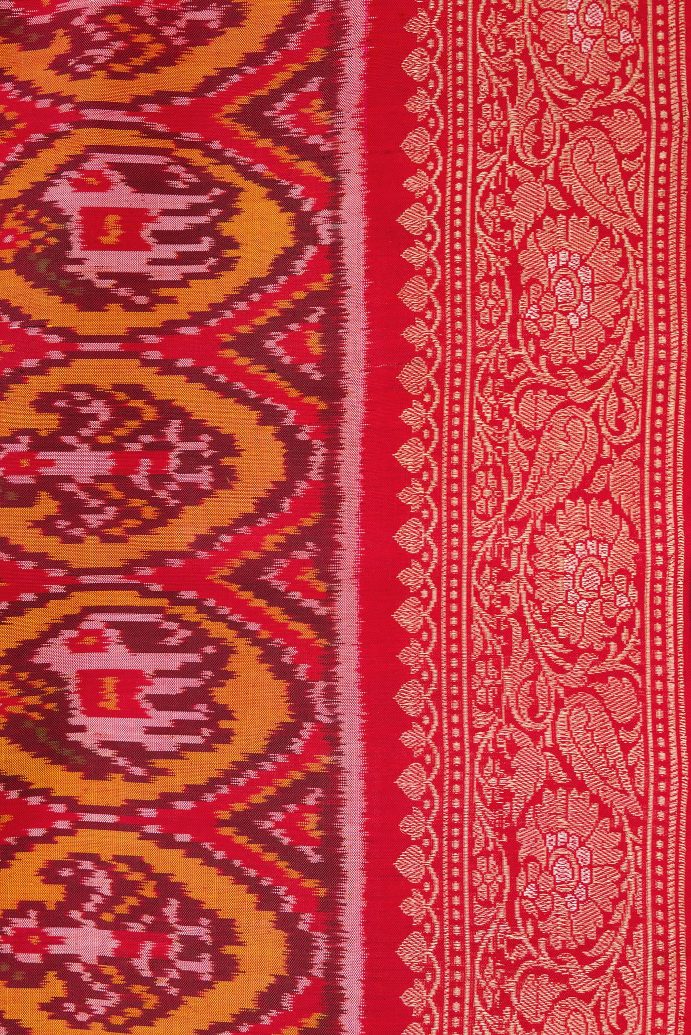 Border image of Red Dual Tone Double Ikat Saree with Ikat Print on the body and Zari Border. 