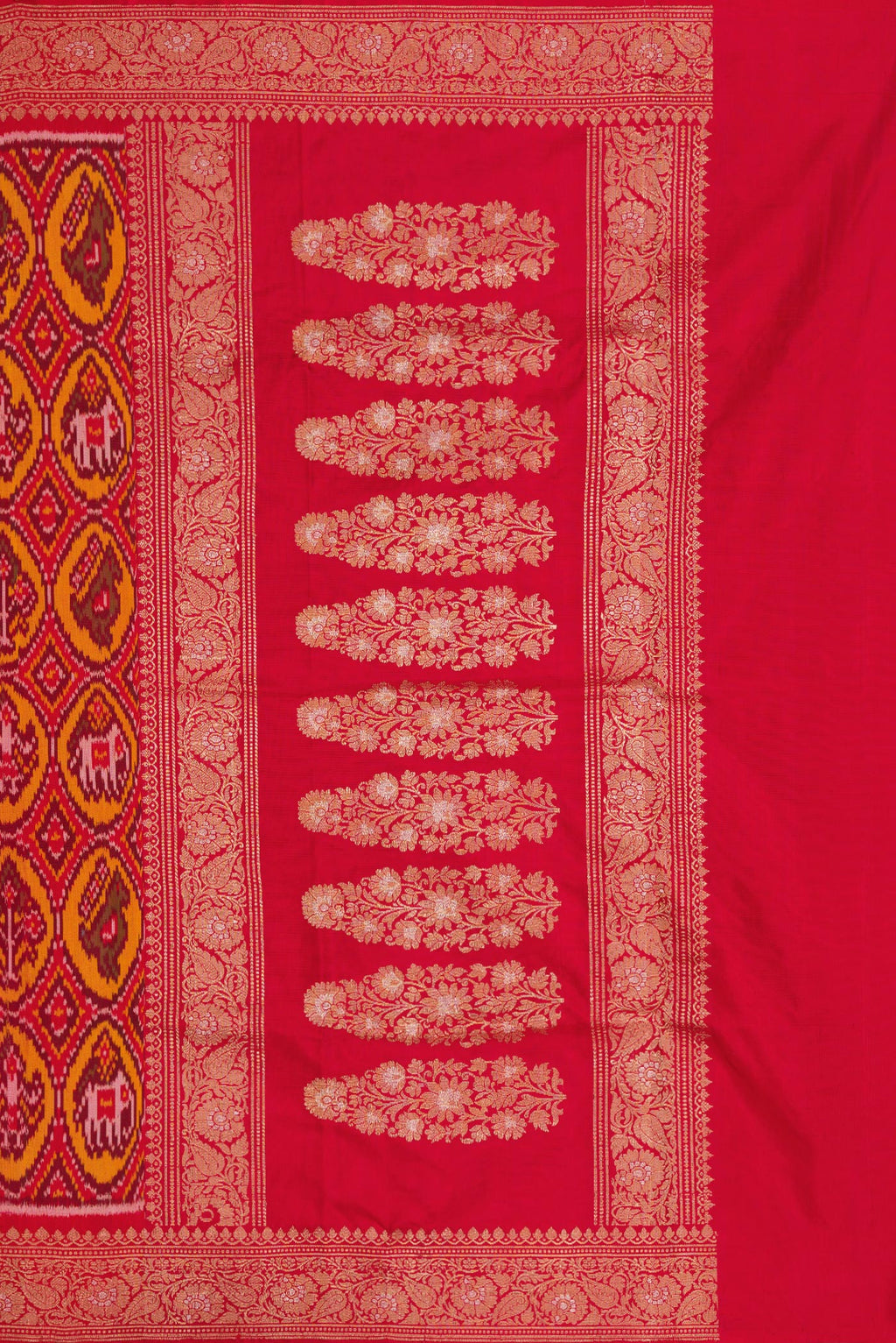 Close up image of the pallu of Red Dual Tone Double Ikat Saree with Ikat Print on the body and Zari Border. 