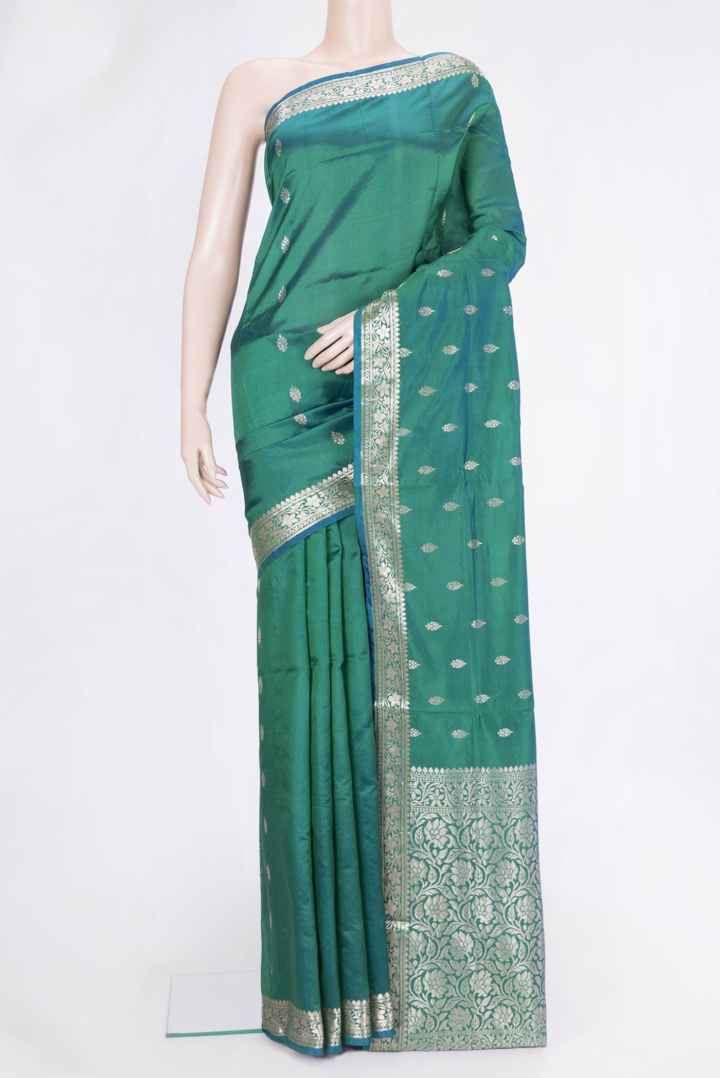 Green Dual Tone Banarasi Silk Saree with Zari Butta on the body and Zari Border.  displayed on a mannequin