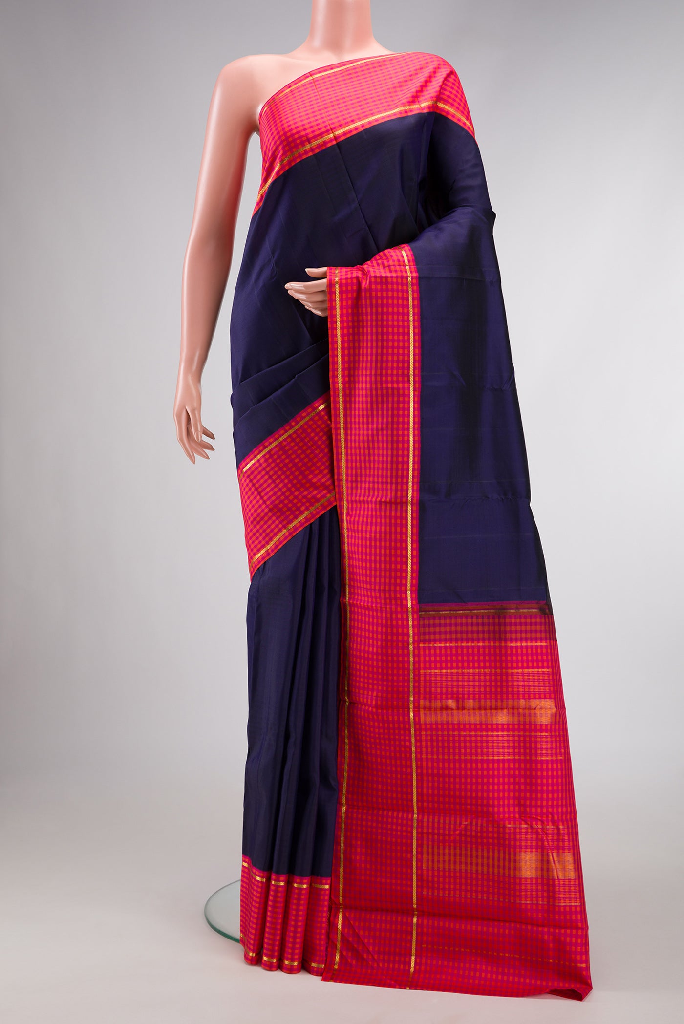 Pure Silk Pure Zari Navy Blue Dual Tone Kanjivaram Saree with Plain Body and Checks Border.  displayed on a mannequin