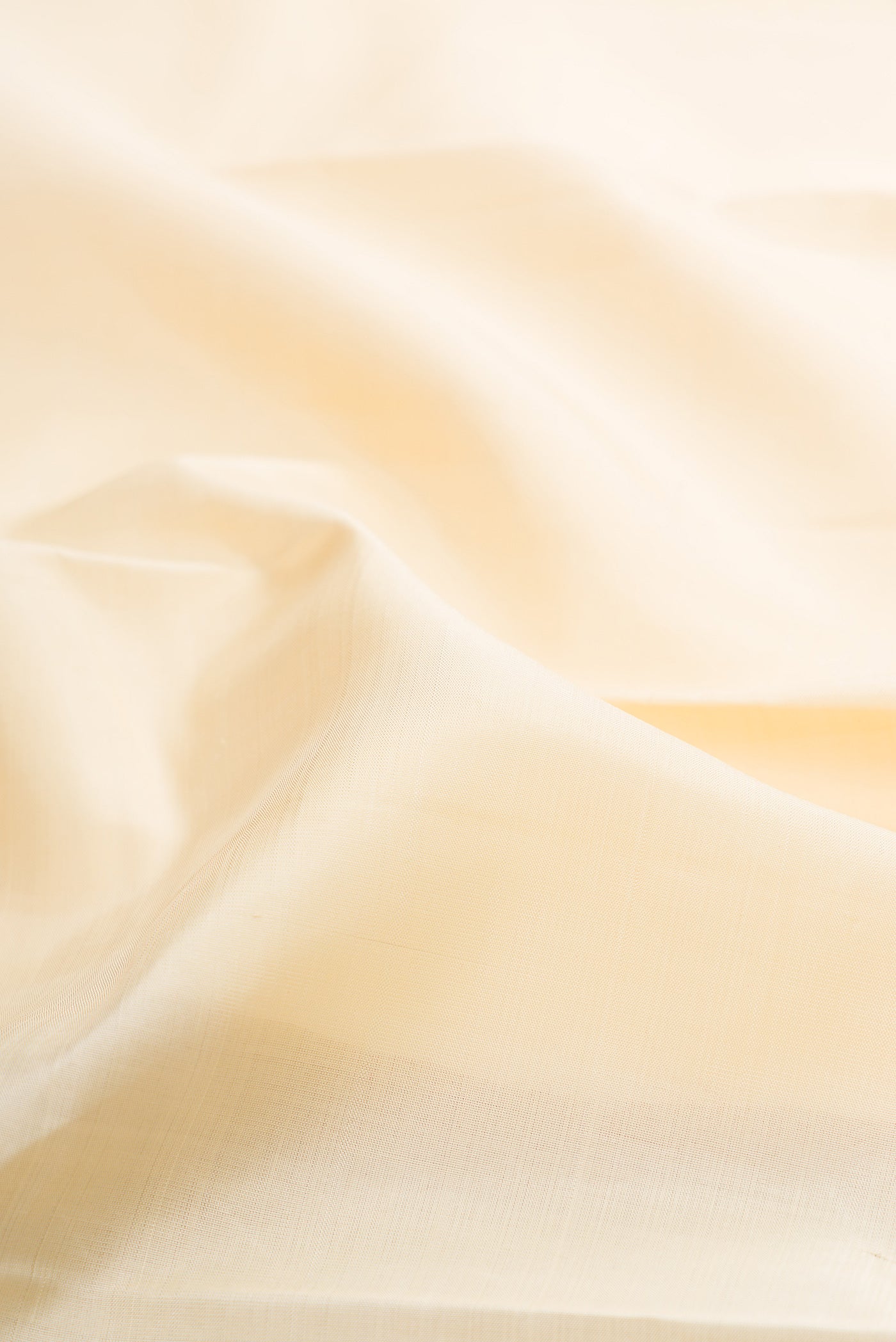 Close up of Sandal Kanjivaram Silk Saree with Plain Body and Temple Border.  displaying folds