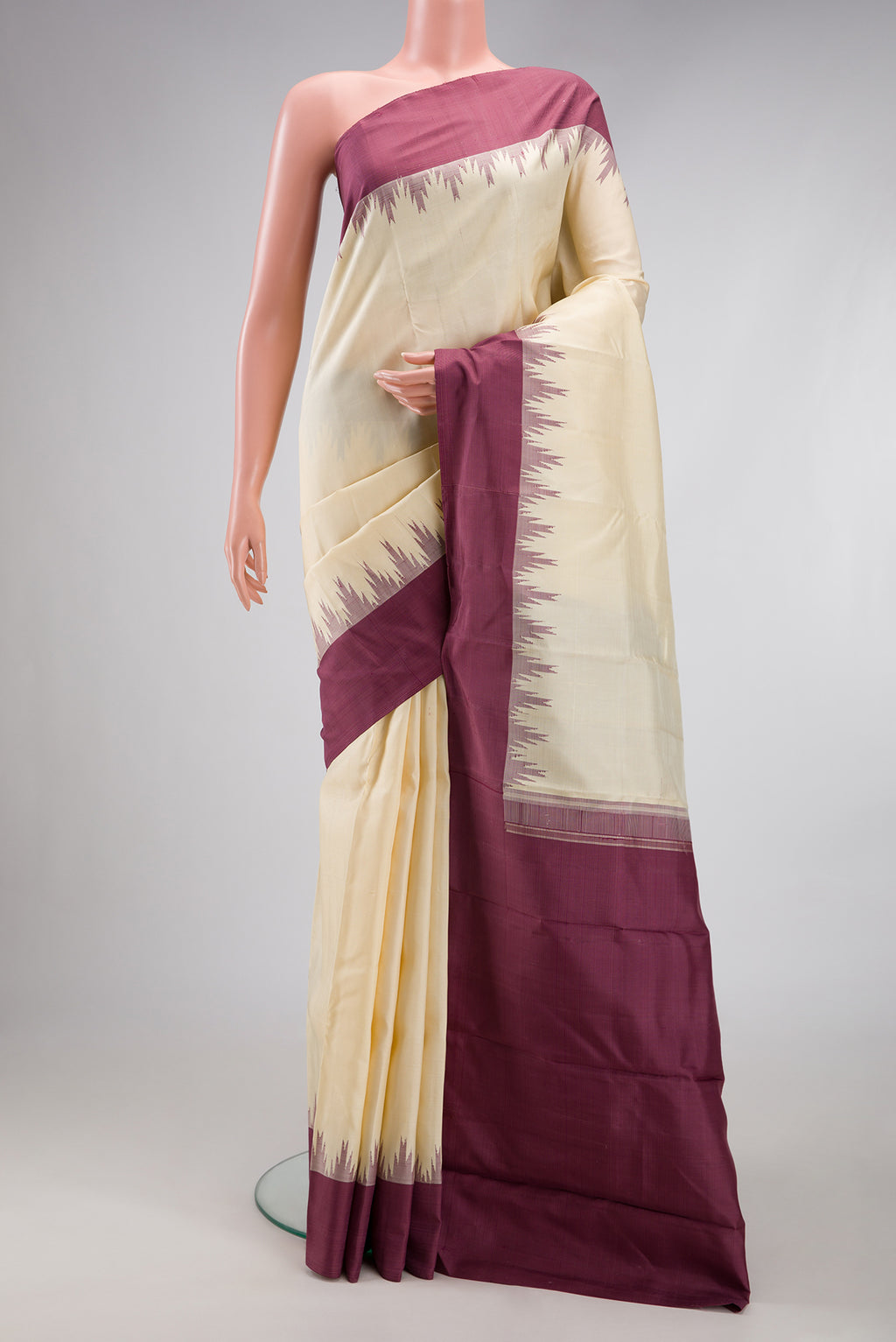 Sandal Kanjivaram Silk Saree with Plain Body and Temple Border.  displayed on a mannequin