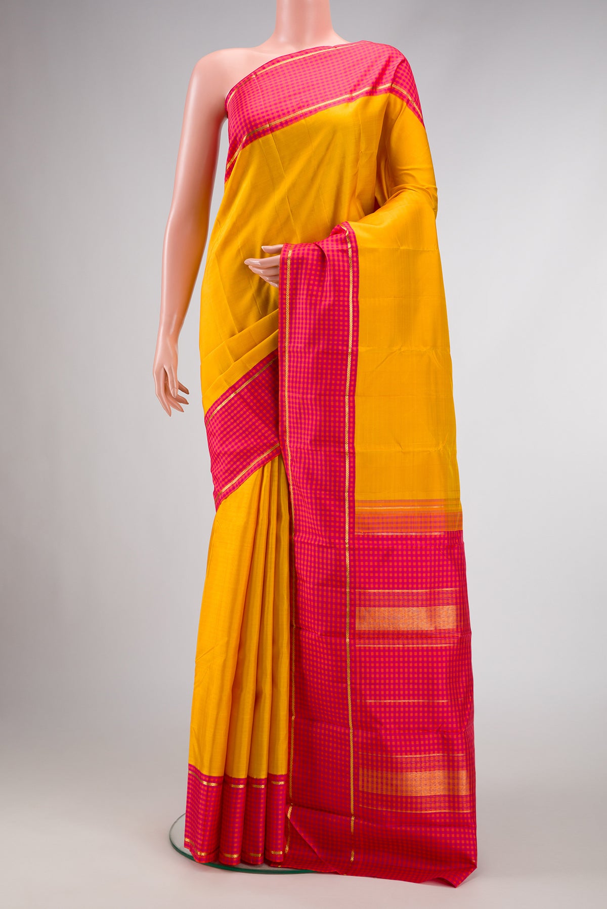 Pure Silk Pure Zari Yellow Dual Tone Kanjivaram Saree with Plain Body and Checks Border.  displayed on a mannequin