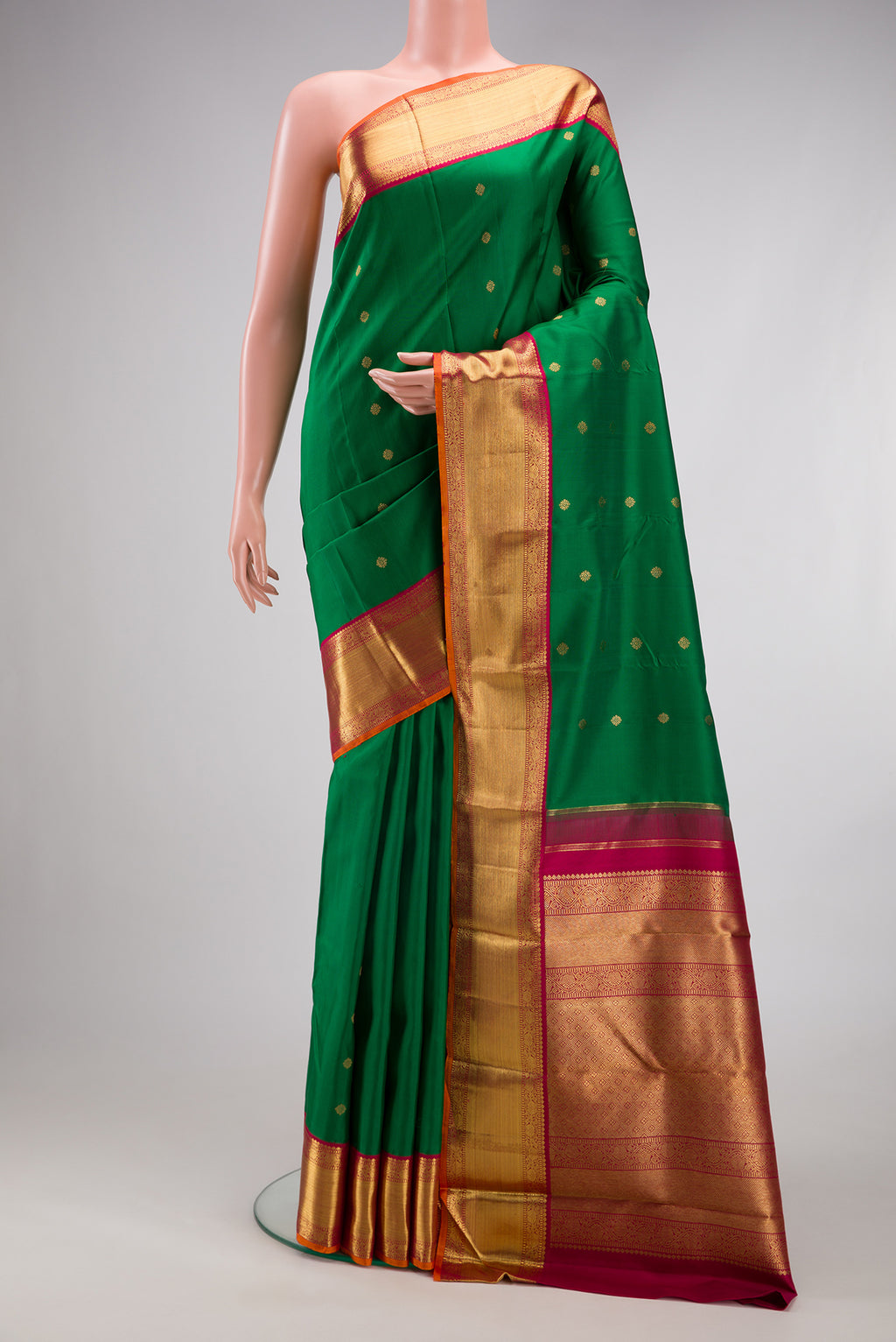 Pure Silk Pure Zari Green Kanjivaram Saree with Zari Butta on the body and Zari Border.  displayed on a mannequin