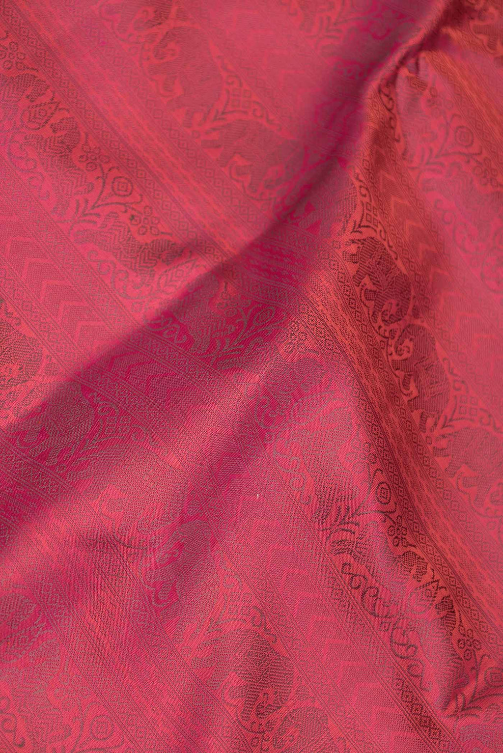 Close up of Pink Dual Tone Kanchipuram Silk Saree with Zari Brocade on the body and Zari Border displaying folds