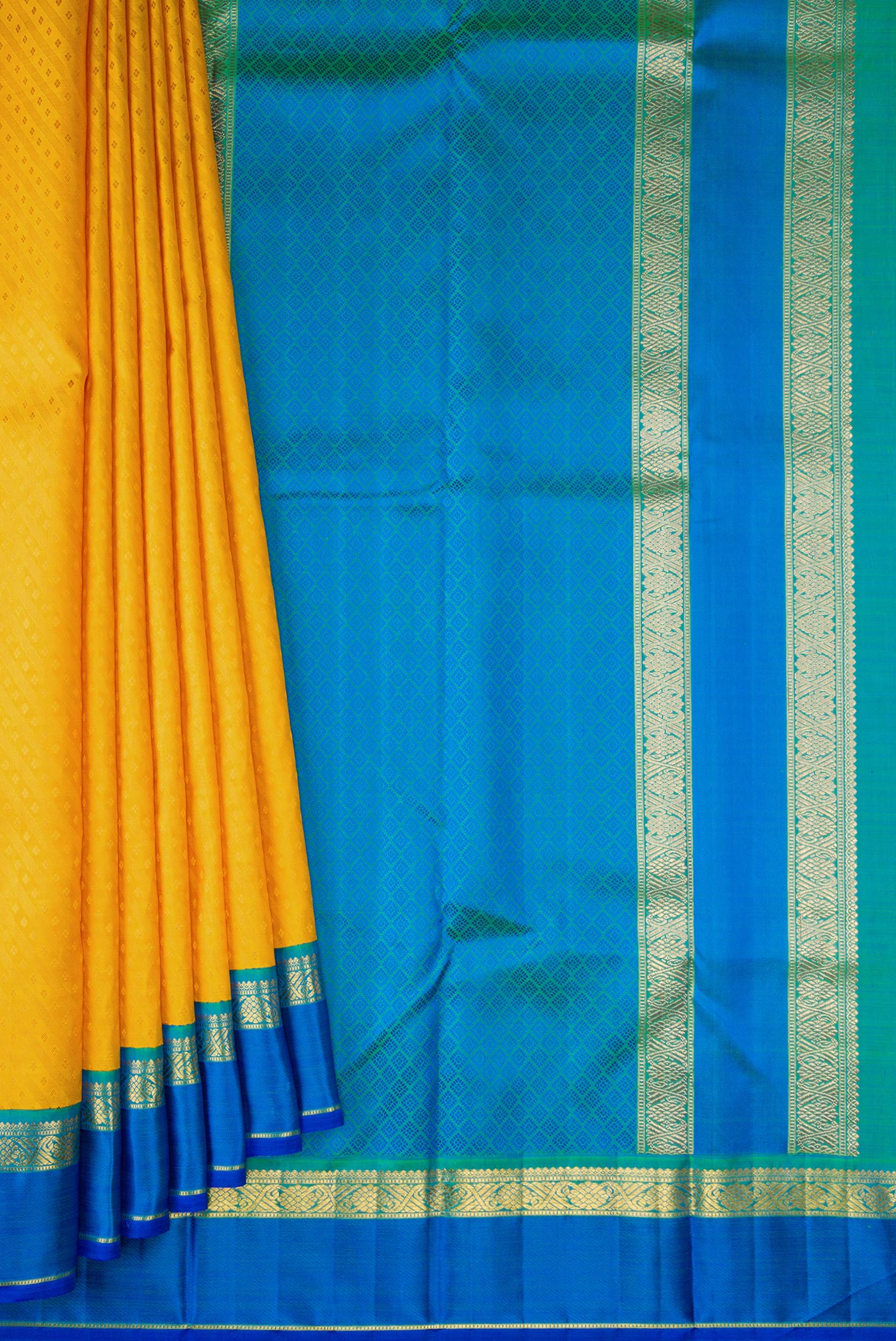 Pleats and pallu of Pure Silk Pure Zari Mustard Dual Tone Kanchipuram Saree with Jacquard design on the body and Zari Border. 