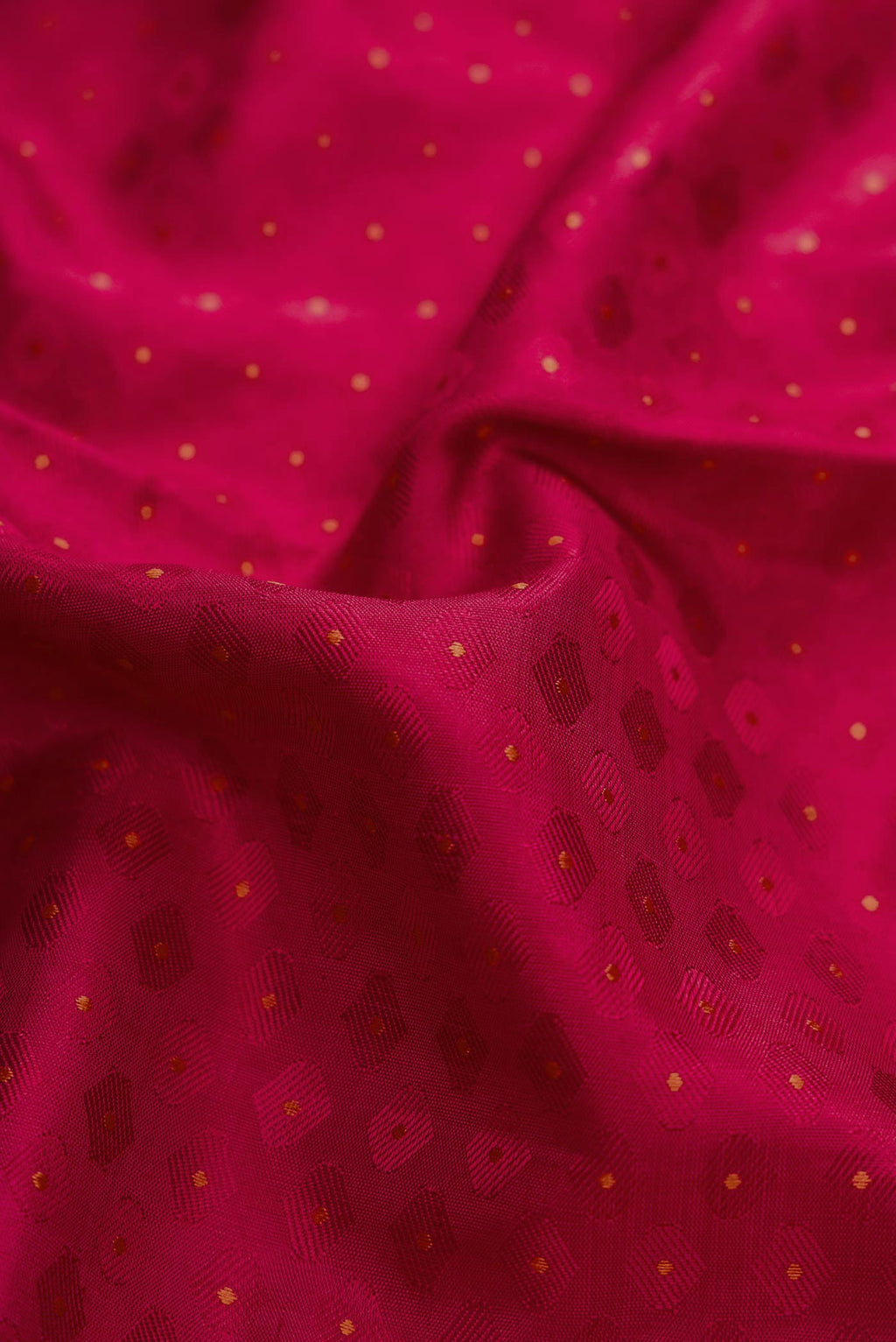 Close up of Pure Silk Pure Zari Maroon Dual Tone Kanchipuram Saree with Jacquard design on the body and Zari Border.  displaying folds