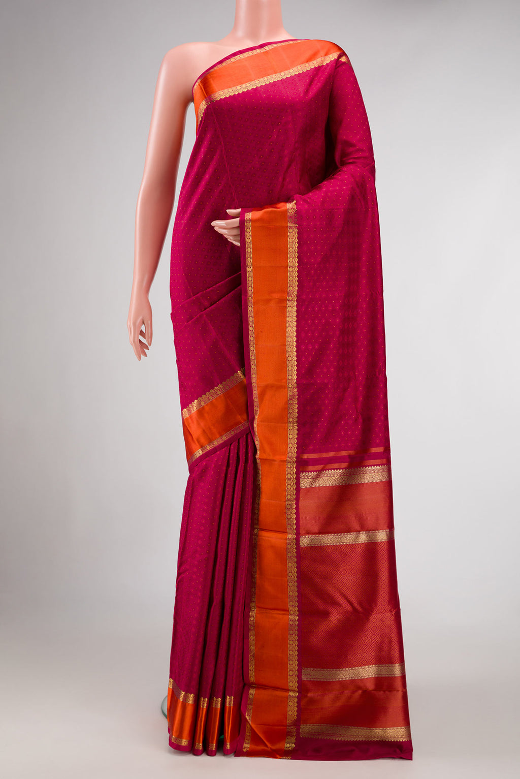 Pure Silk Pure Zari Maroon Dual Tone Kanchipuram Saree with Jacquard design on the body and Zari Border.  displayed on a mannequin