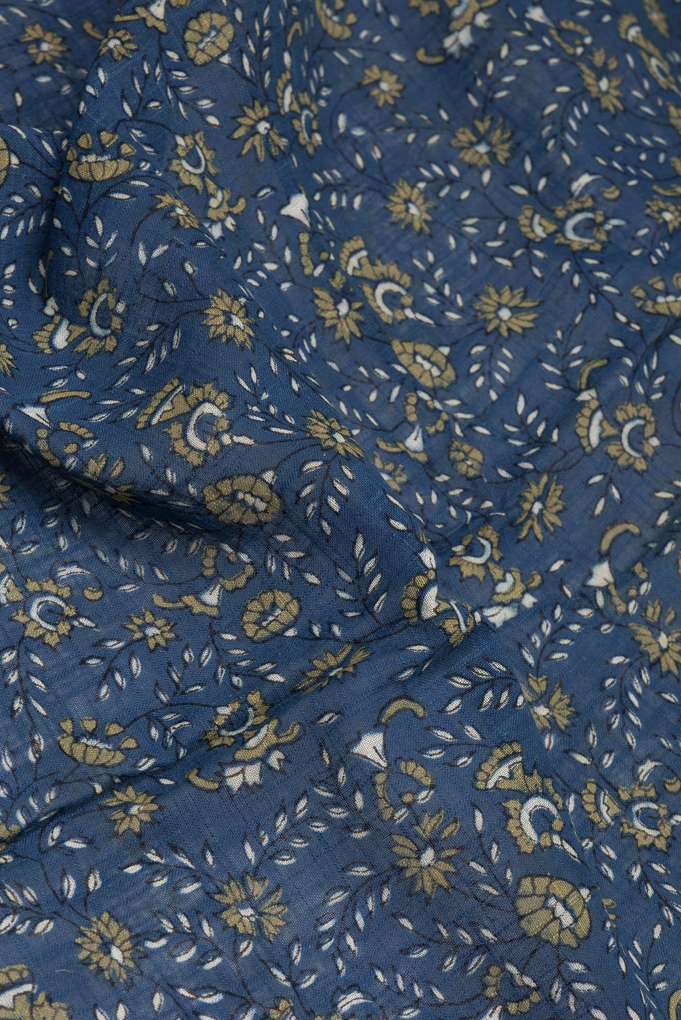 Close up of Grey Linen Saree with Printed design on the body and Zari Border.  displaying folds