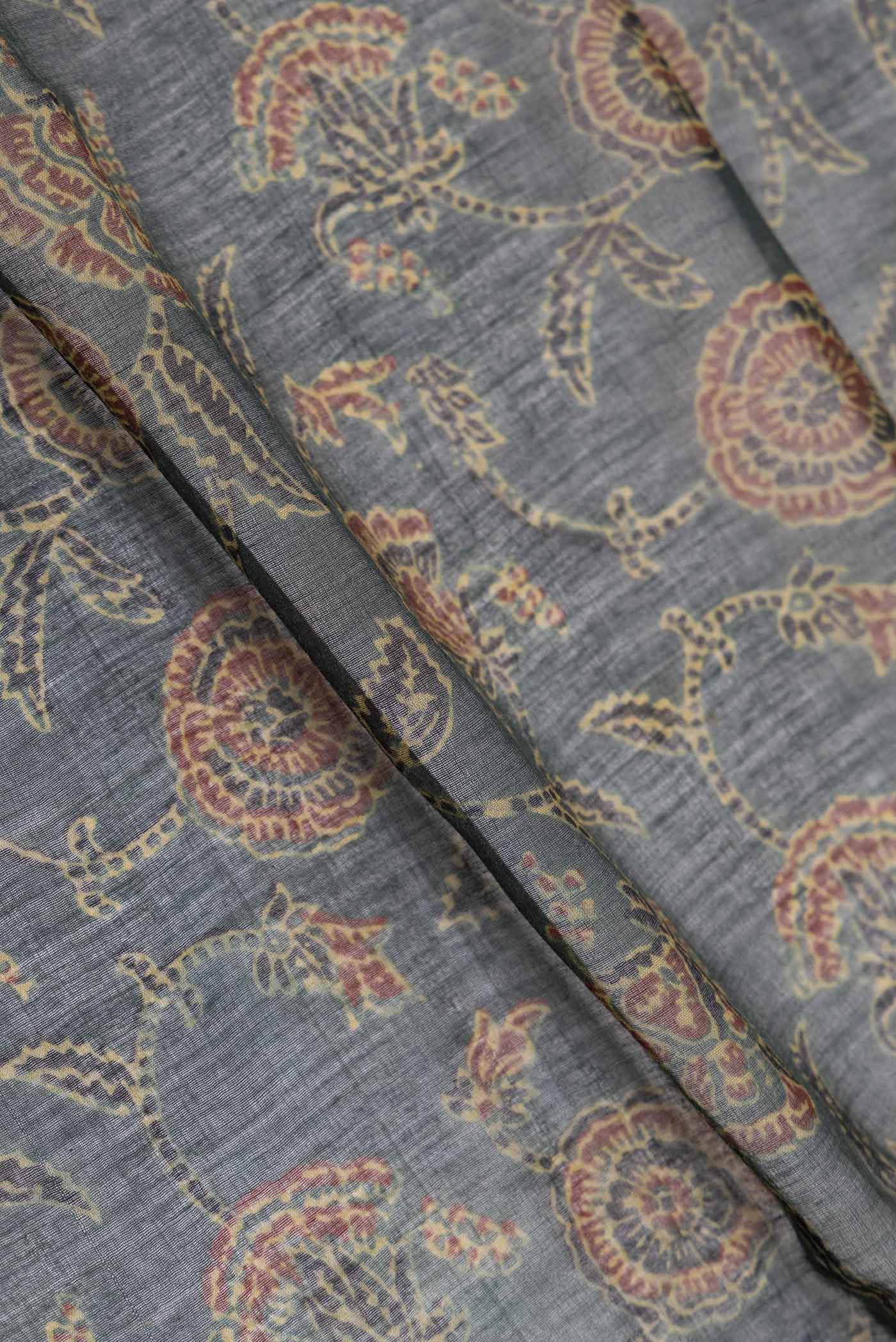 Close up of Green Dual Tone Chanderi Silk Saree with Printed design on the body and Zari Border displaying folds