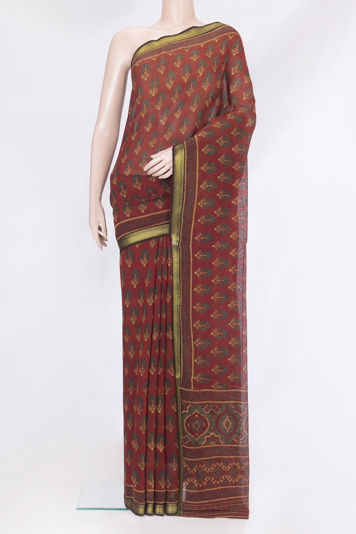 Maroon Chanderi Silk Cotton Saree with Ajrakh Print on the body and Zari Border.  displayed on a mannequin