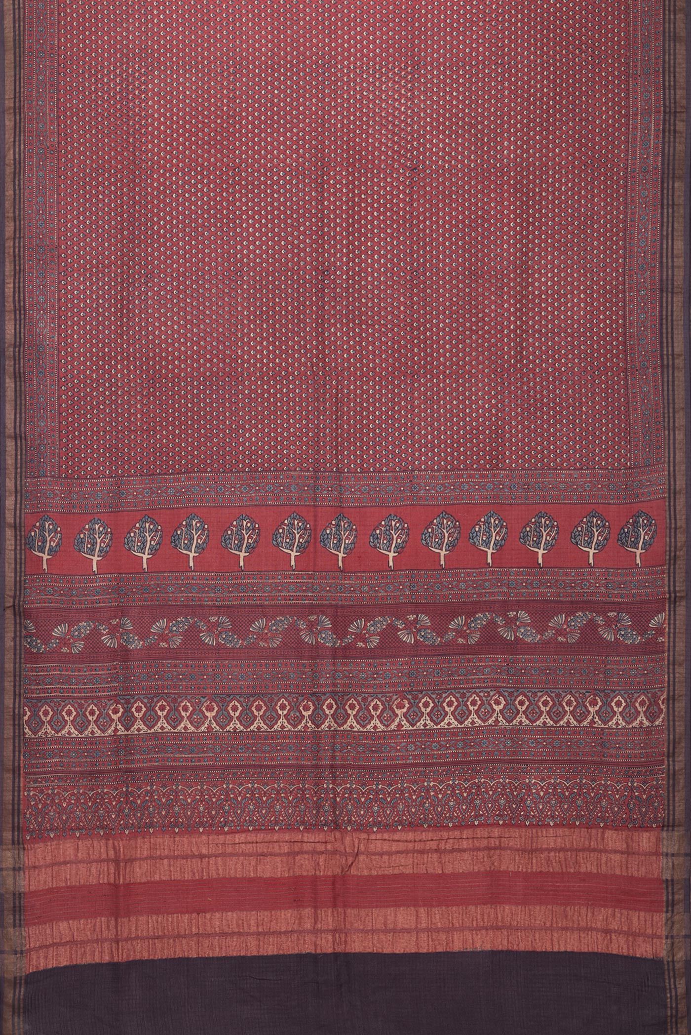Flat view of Maroon Jute Silk Saree with Ajrakh Print on the body and Zari Border. 