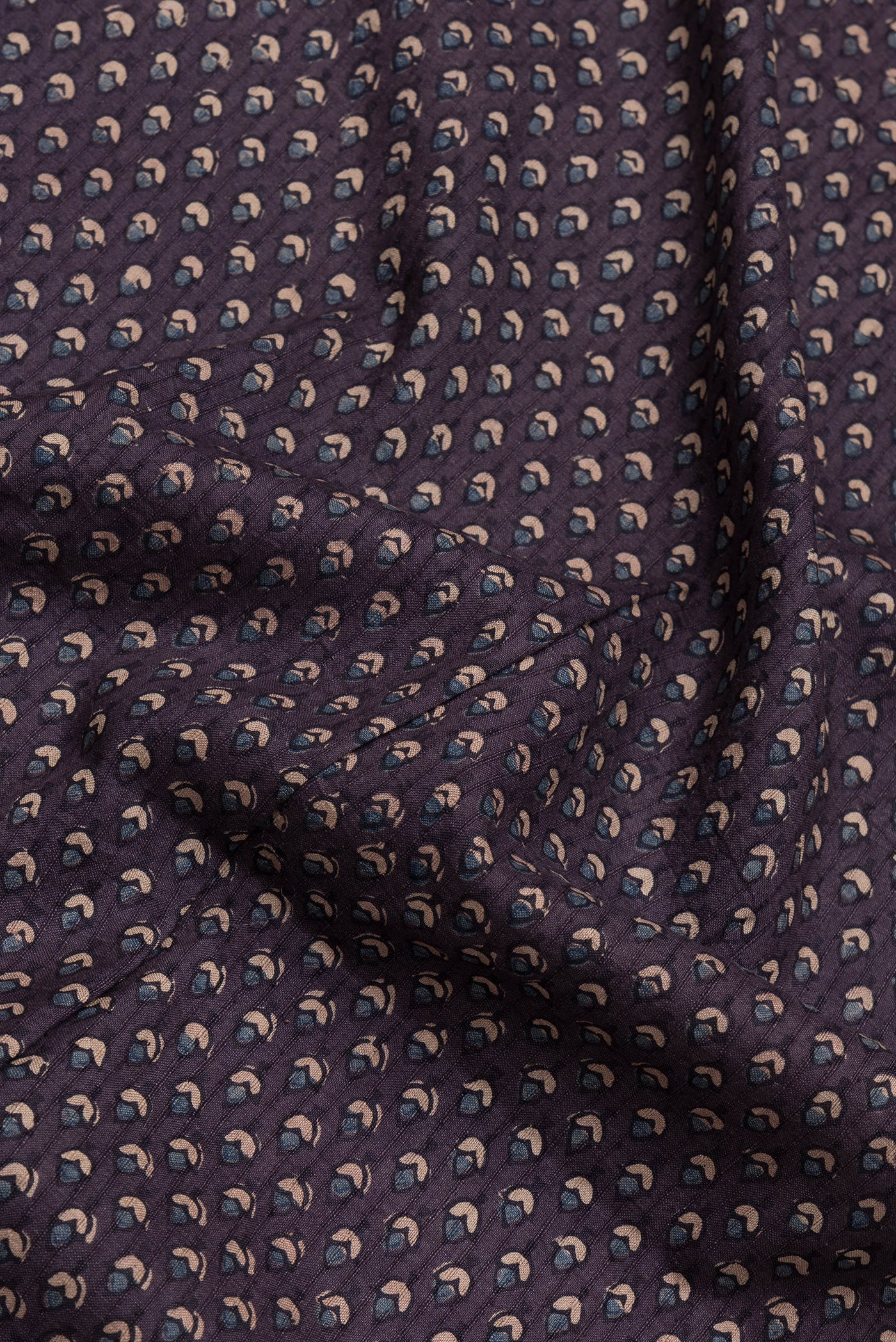 Close up of Purple Dual Tone Linen Saree with Printed design on the body and Zari Border.  displaying folds