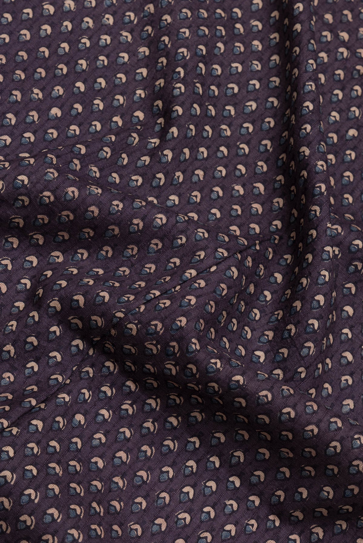 Close up of Purple Dual Tone Linen Saree with Printed design on the body and Zari Border.  displaying folds