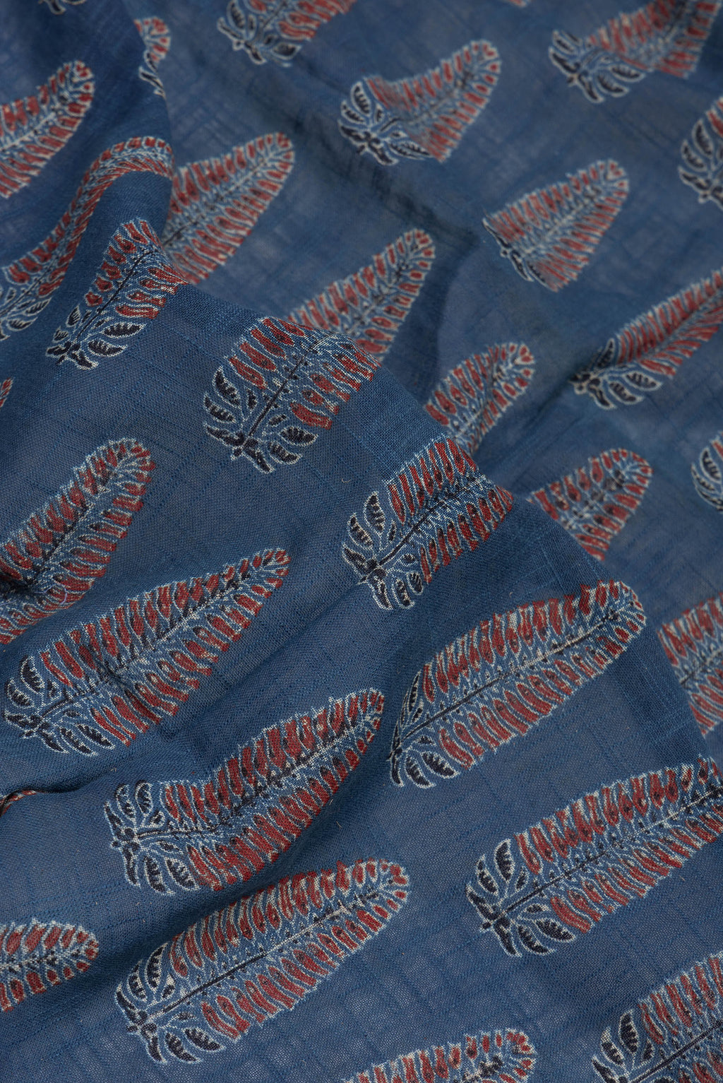 Close up of Indigo Linen Saree with Ajrakh Print on the body and Zari Border.  displaying folds
