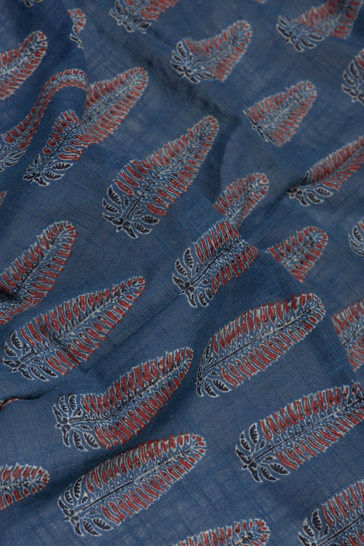 Close up of Indigo Linen Saree with Ajrakh Print on the body and Zari Border.  displaying folds