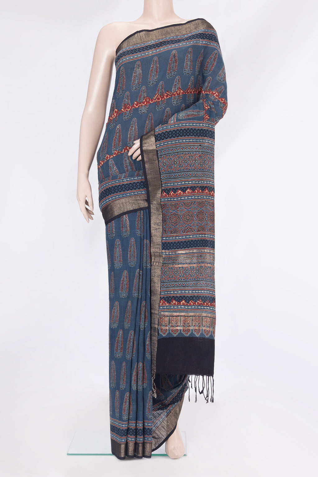 Indigo Linen Saree with Ajrakh Print on the body and Zari Border.  displayed on a mannequin
