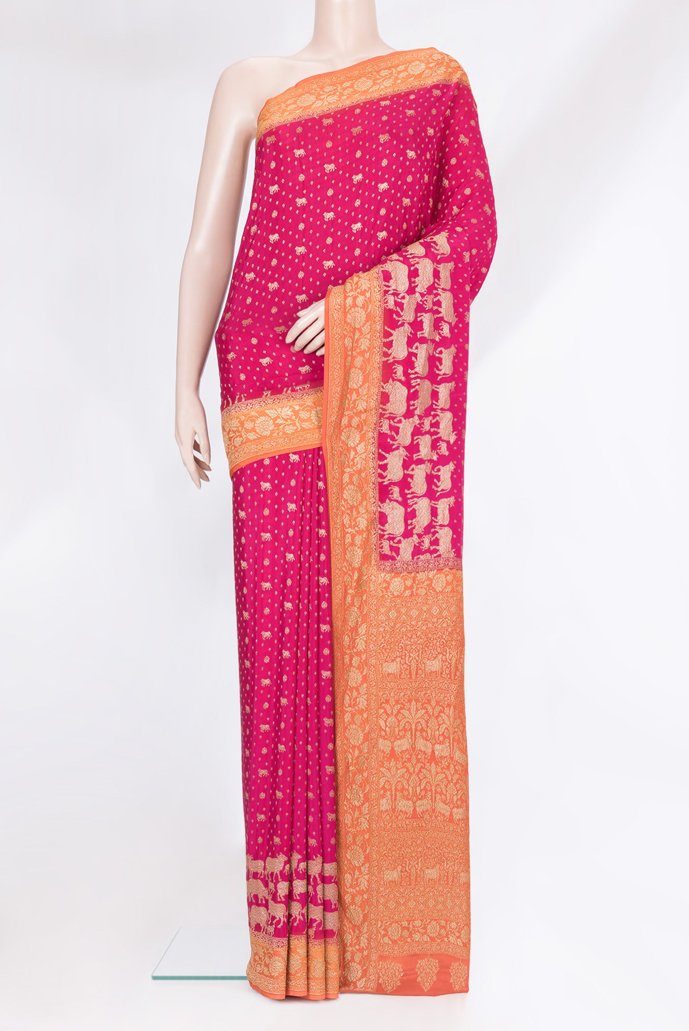 Pink Banarasi Georgette Saree with Zari Brocade on the body and Zari Border.  displayed on a mannequin