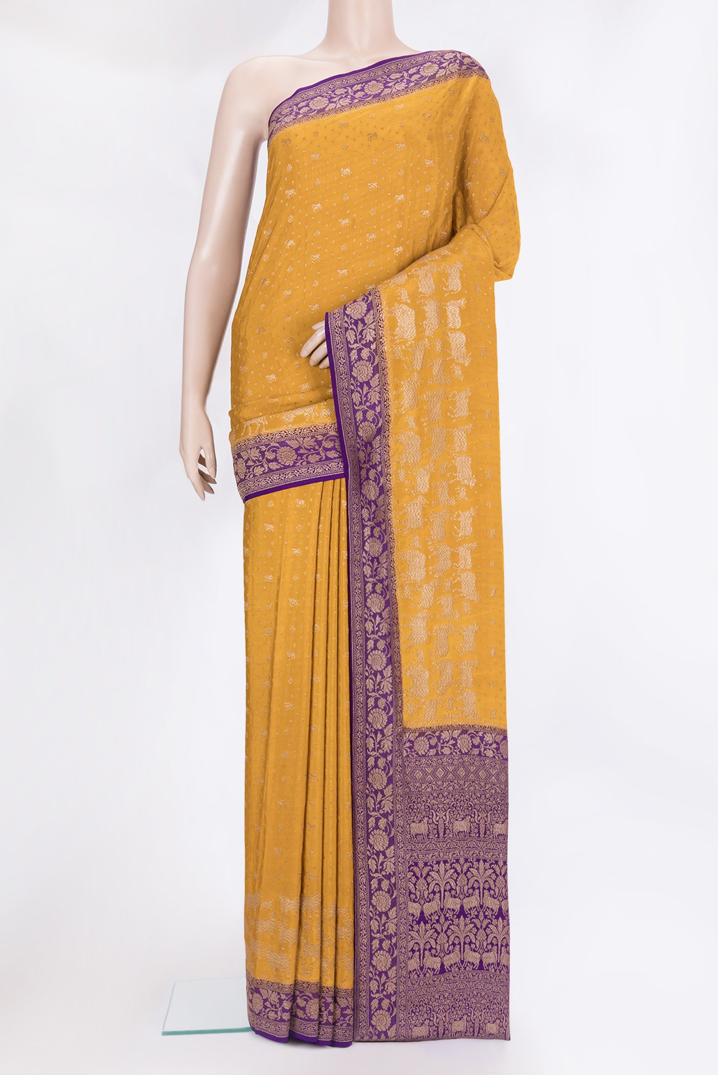 Mustard Banarasi Georgette Saree with Zari Butta on the body and Zari Border.  displayed on a mannequin