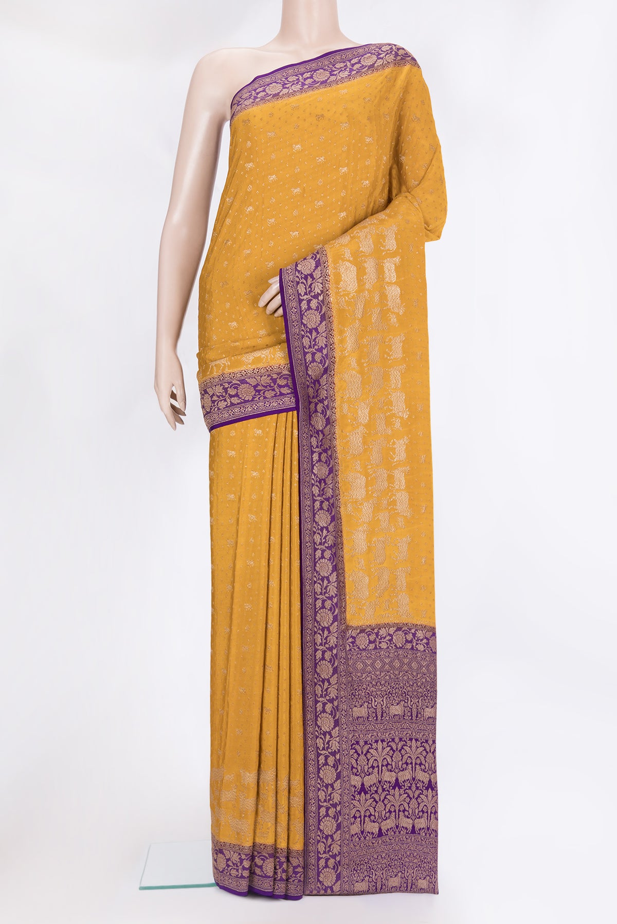 Mustard Banarasi Georgette Saree with Zari Butta on the body and Zari Border.  displayed on a mannequin