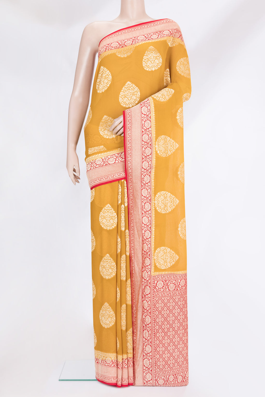Mustard Banarasi Georgette Saree with Zari Butta on the body and Zari Border.  displayed on a mannequin