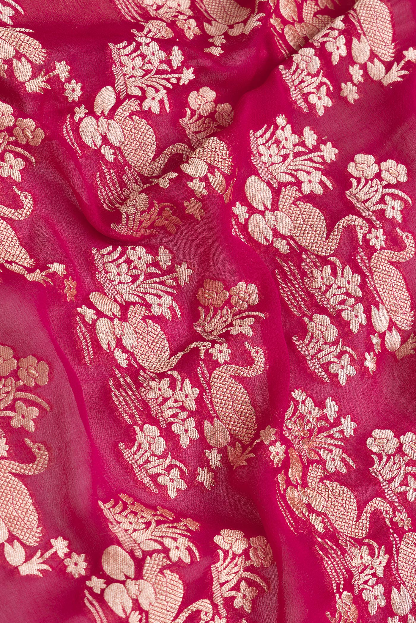 Close up of Pink Dual Tone Banarasi Georgette Saree with Zari Brocade on the body and Zari Border.  displaying folds