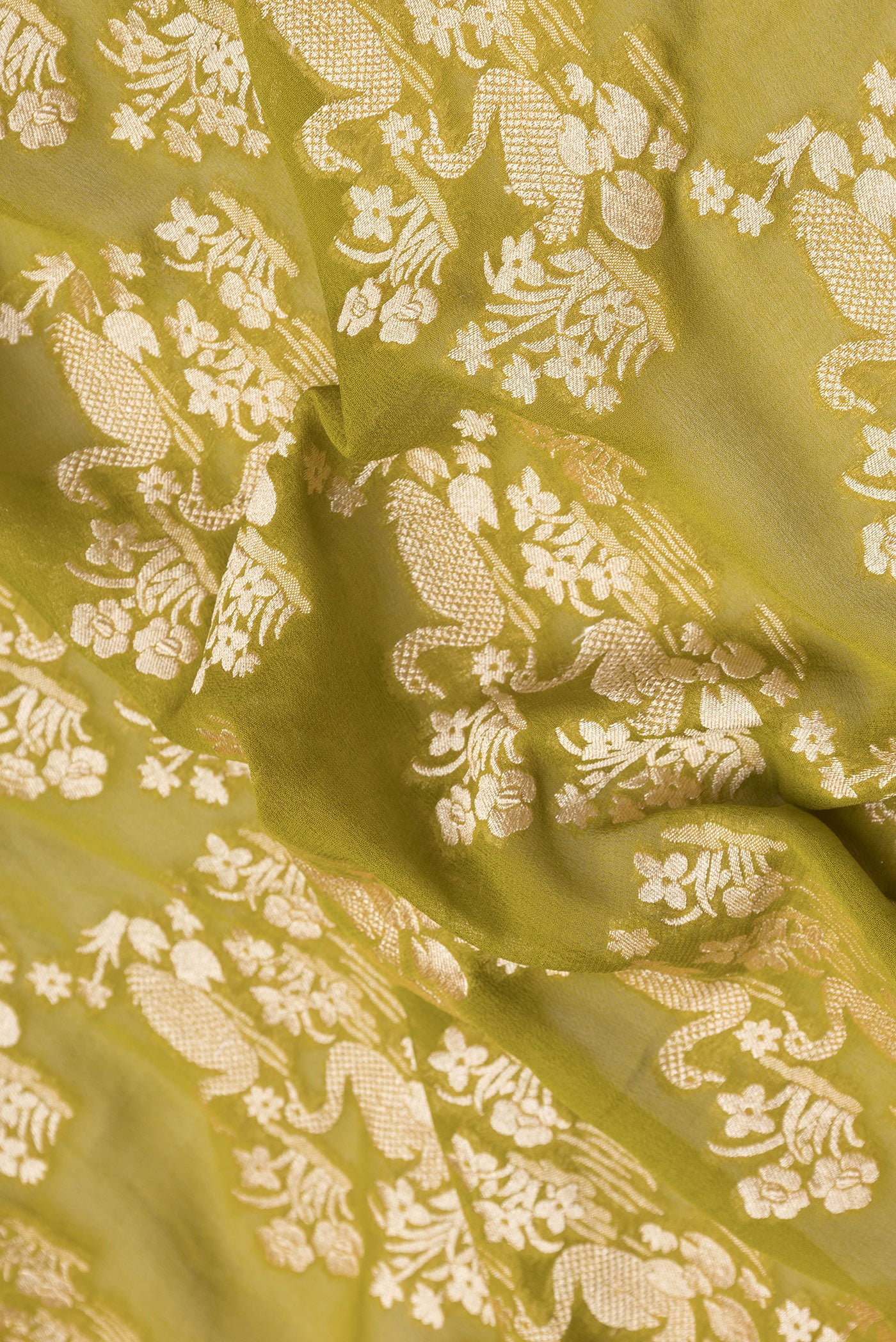 Close up of Mehandi Green Dual Tone Banarasi Georgette Saree with Zari Brocade on the body and Zari Border.  displaying folds