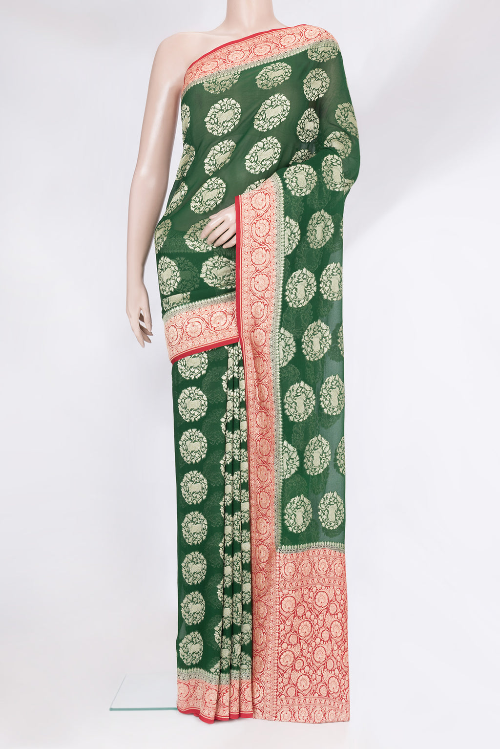Bottle Green Banarasi Georgette Saree with Zari Brocade on the body and Zari Border.  displayed on a mannequin