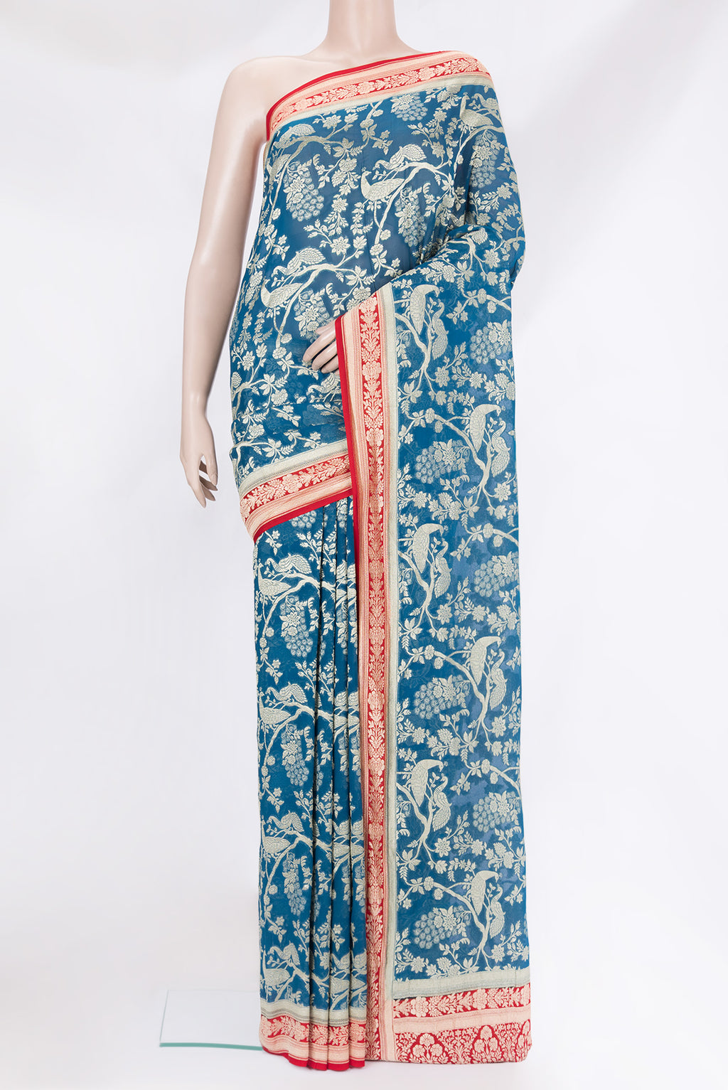 Peacock Blue Banarasi Georgette Saree with Zari Brocade on the body and Zari Border.  displayed on a mannequin