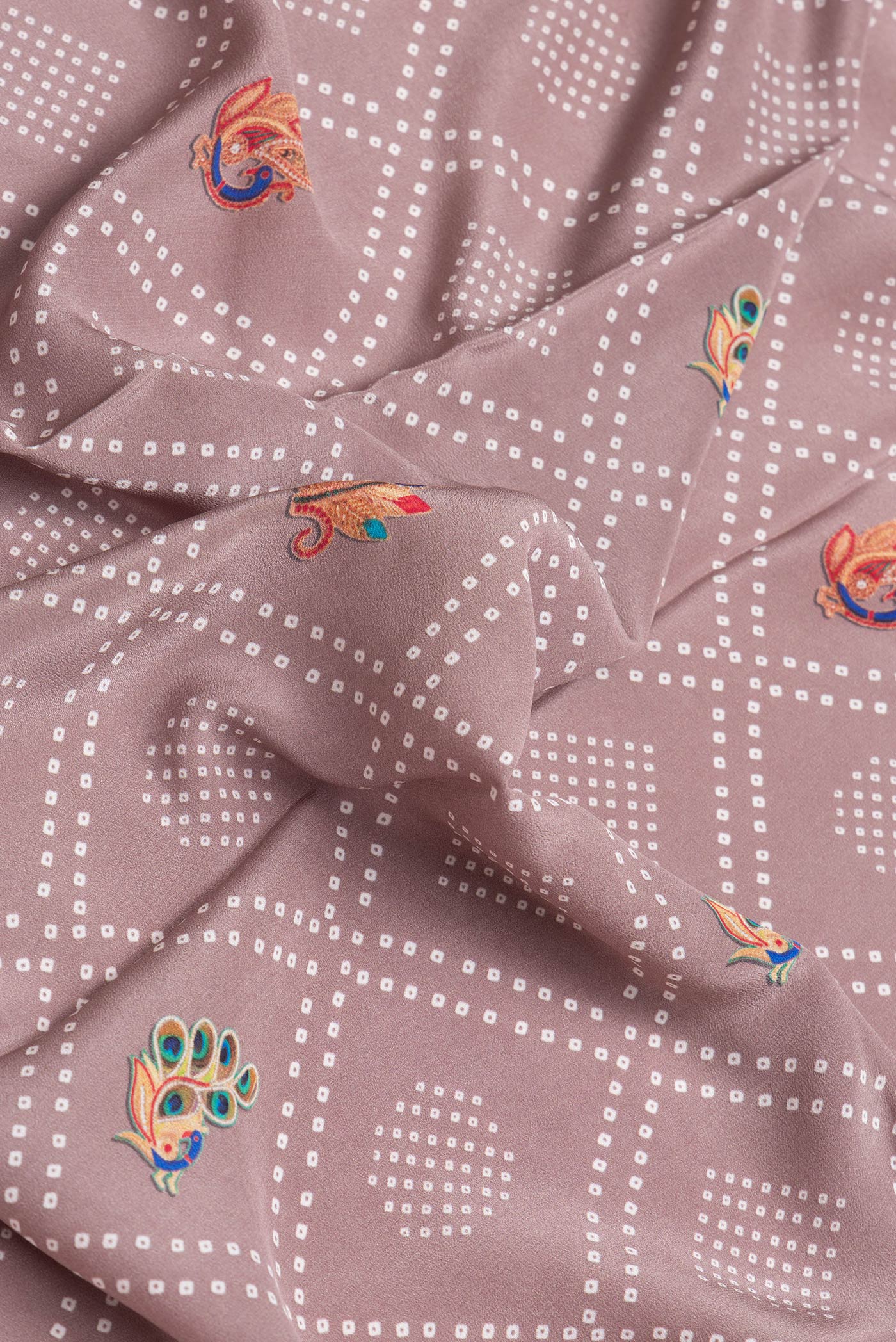 Close up of Brown Dual Tone Mysore Crepe Saree with Printed design on the body and Printed Border.  displaying folds