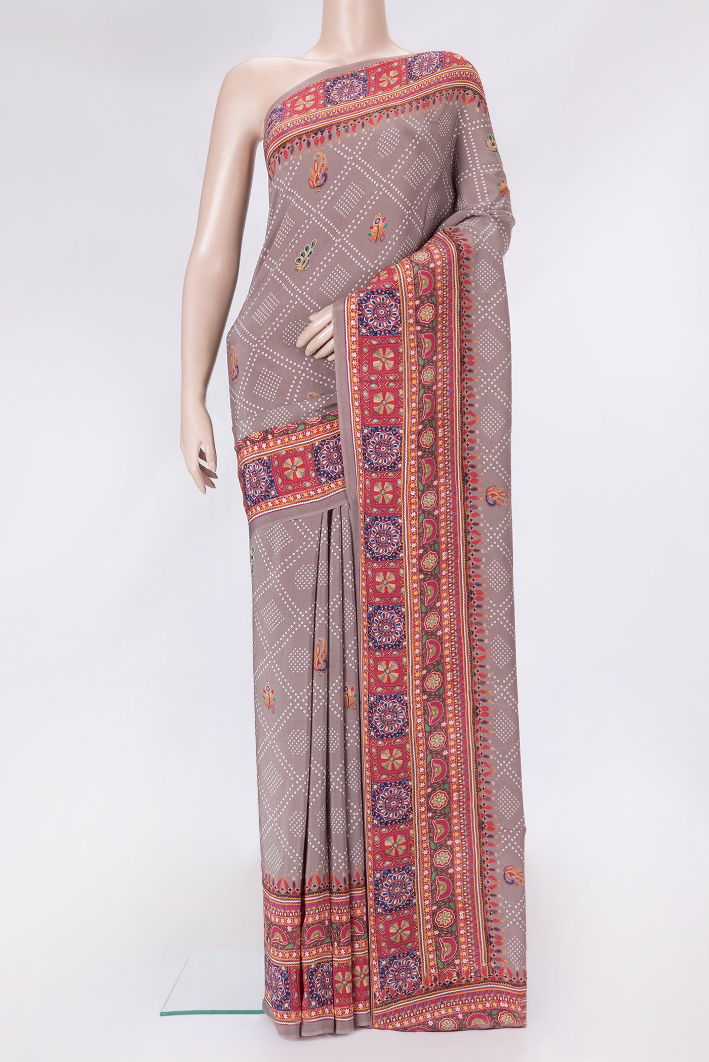 Brown Dual Tone Mysore Crepe Saree with Printed design on the body and Printed Border.  displayed on a mannequin