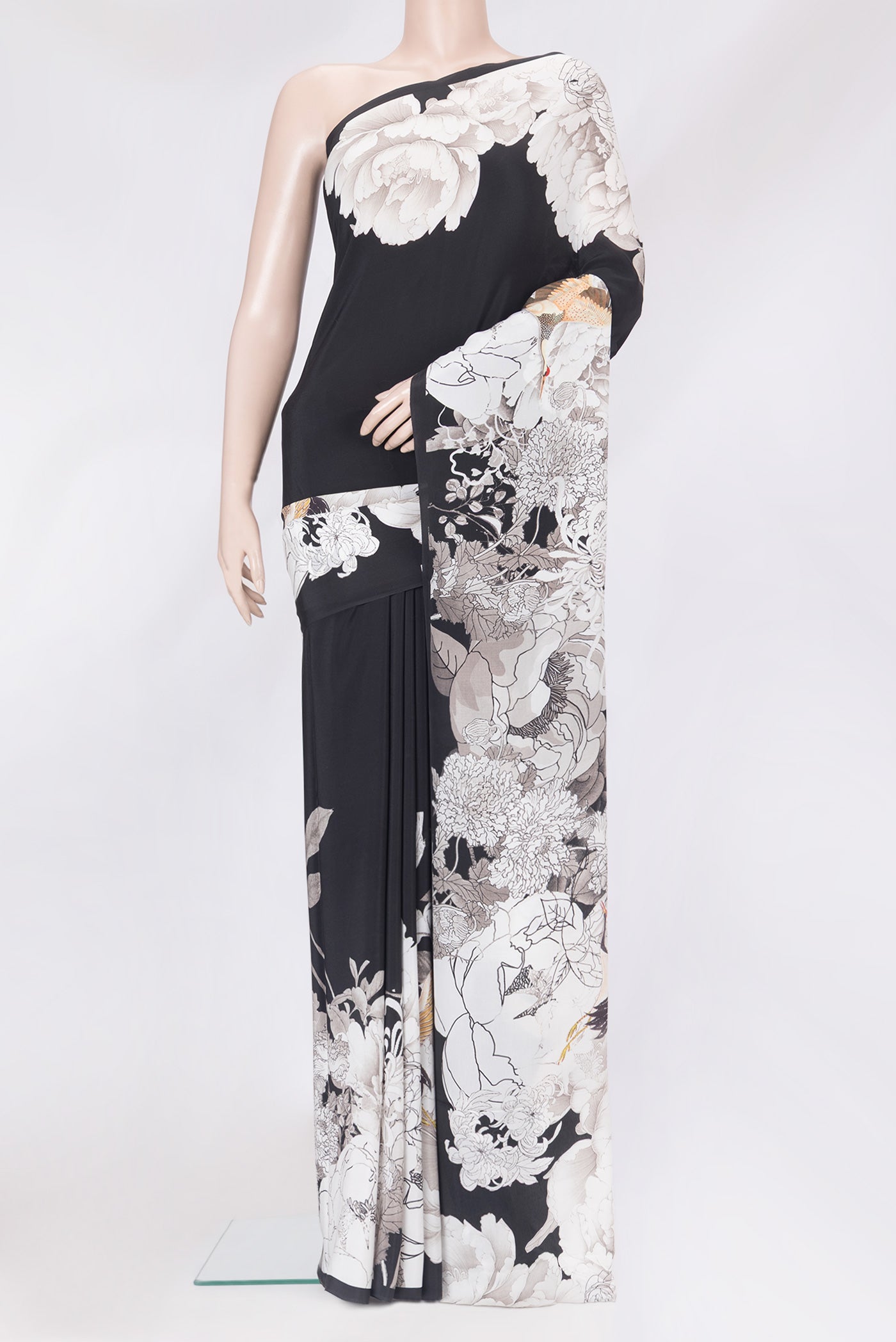 Black Mysore Crepe Saree with Printed design on the body and Without Border.  displayed on a mannequin