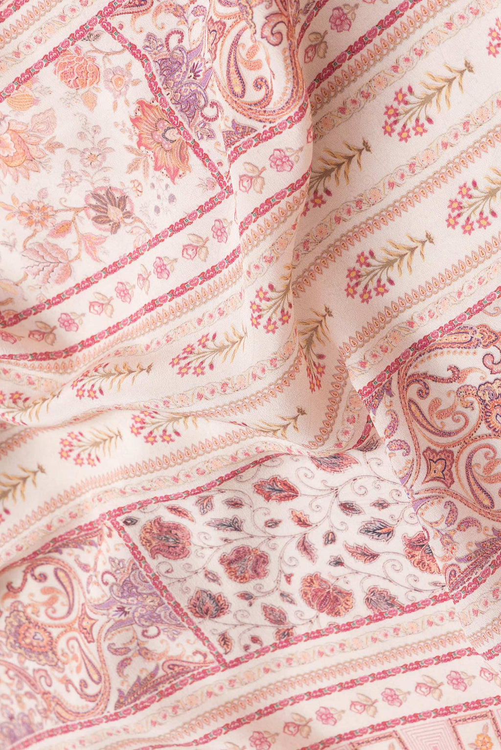 Close up of Beige Dual Tone Mysore Crepe Saree with Printed design on the body and Printed Border.  displaying folds