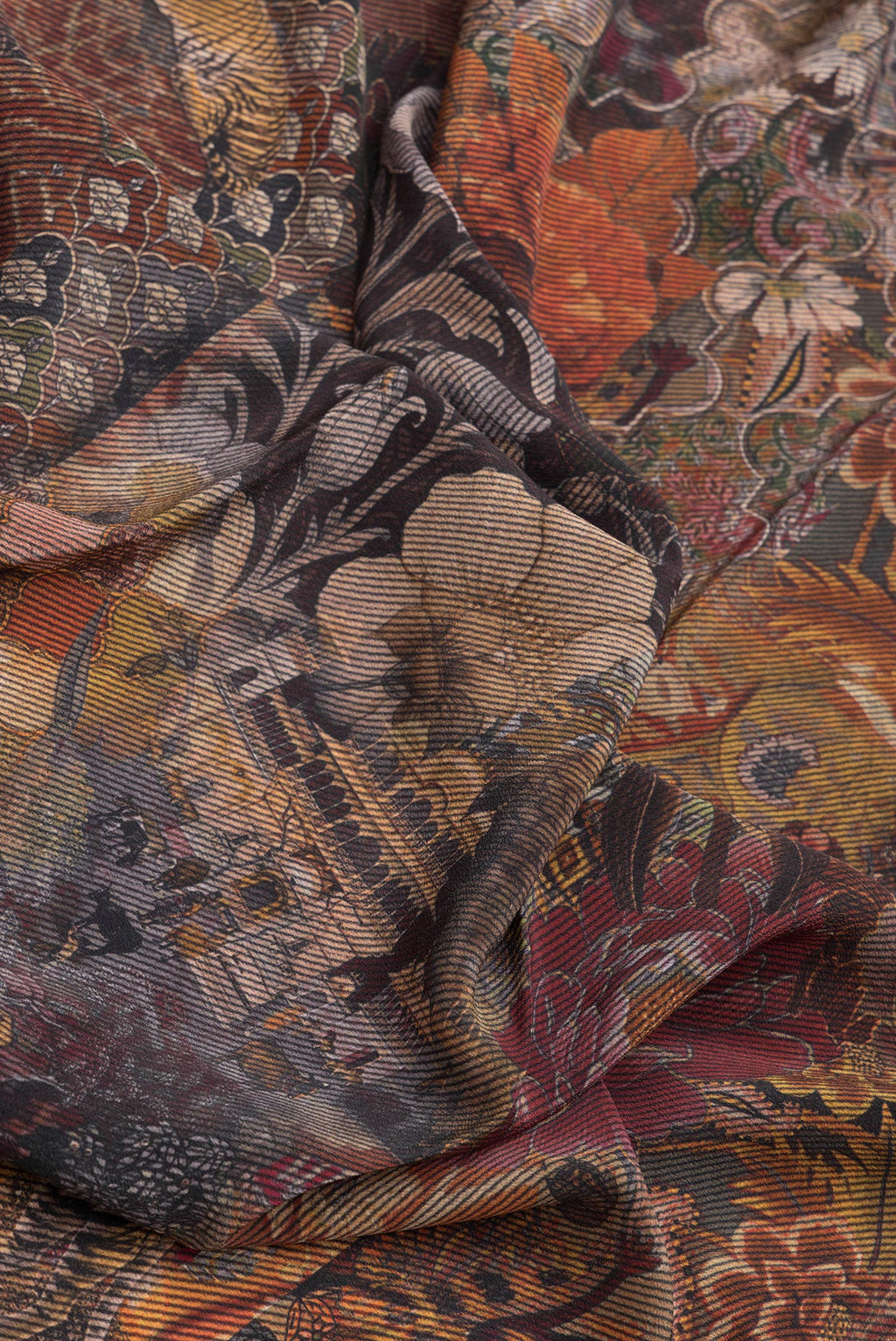 Close up of Black Mysore Crepe Saree with Printed design on the body and Plain Border.  displaying folds